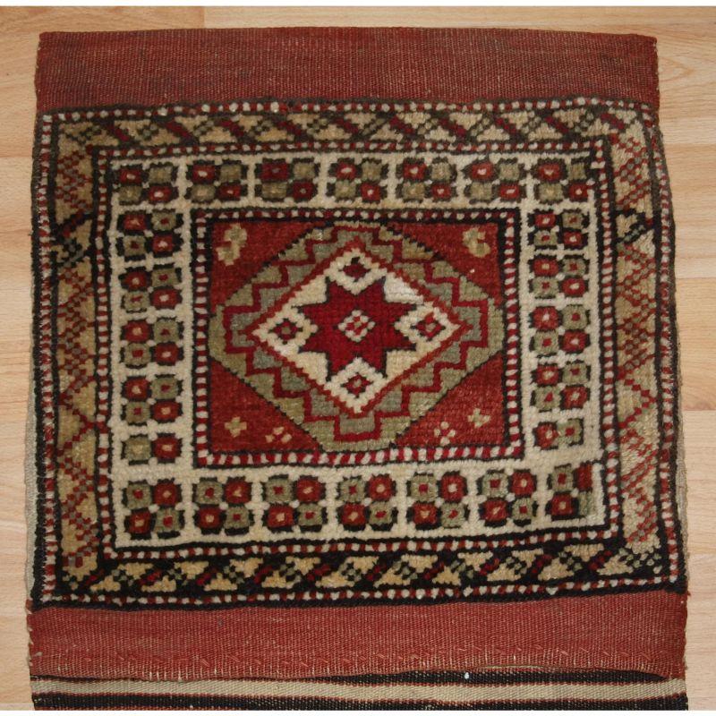Antique pair of heybe (saddle bags) from the Bergama region of Western Anatolia (Turkey).

This complete pair of saddle bags are in near perfect condition, the piled faces have a large star design. An outstanding feature is the stripped flat woven