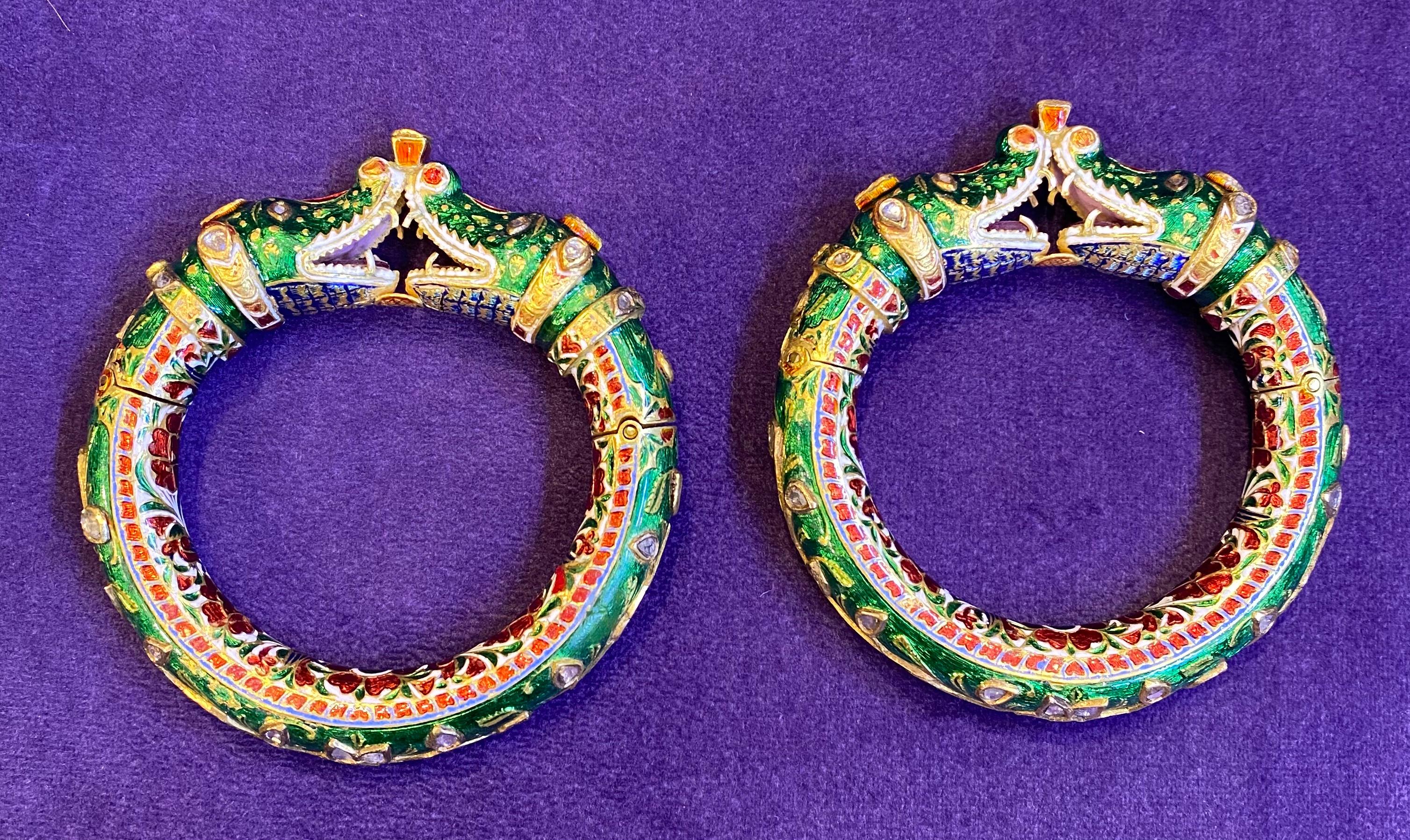 Antique Pair of Indian Makara Bangles

Pair of enamel bangles forming a Makara motif, clasp has a screw for a secure lock.

Measurements: 6.5