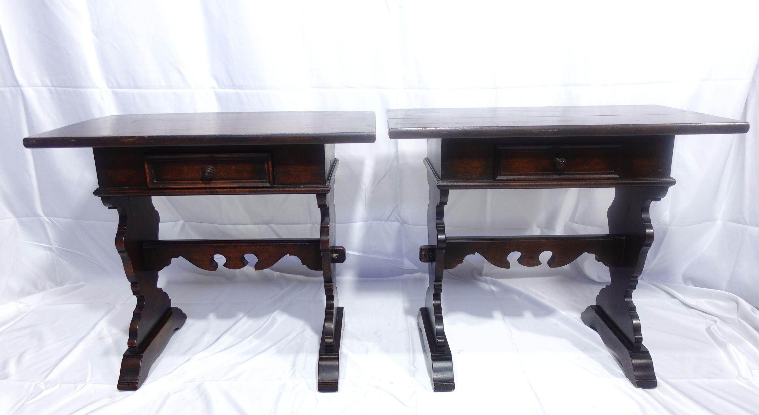 A Pair of charming Italian baroque walnut single-drawer side tables raised on trestle supports.
