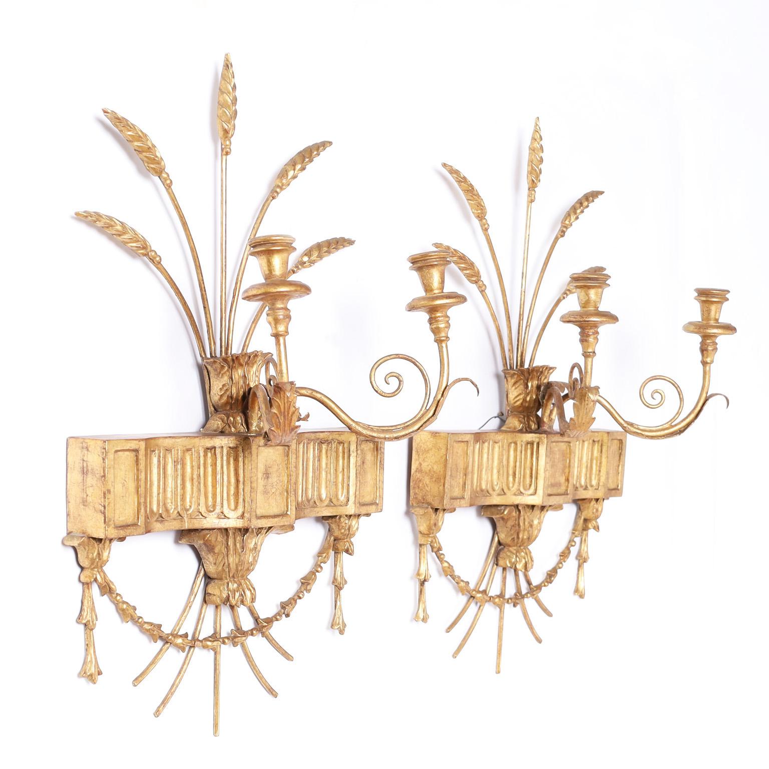 Antique pair of two light wall sconces crafted in metal and wood with a wheat stalk motif, retaining the original gilt finish now worn.
