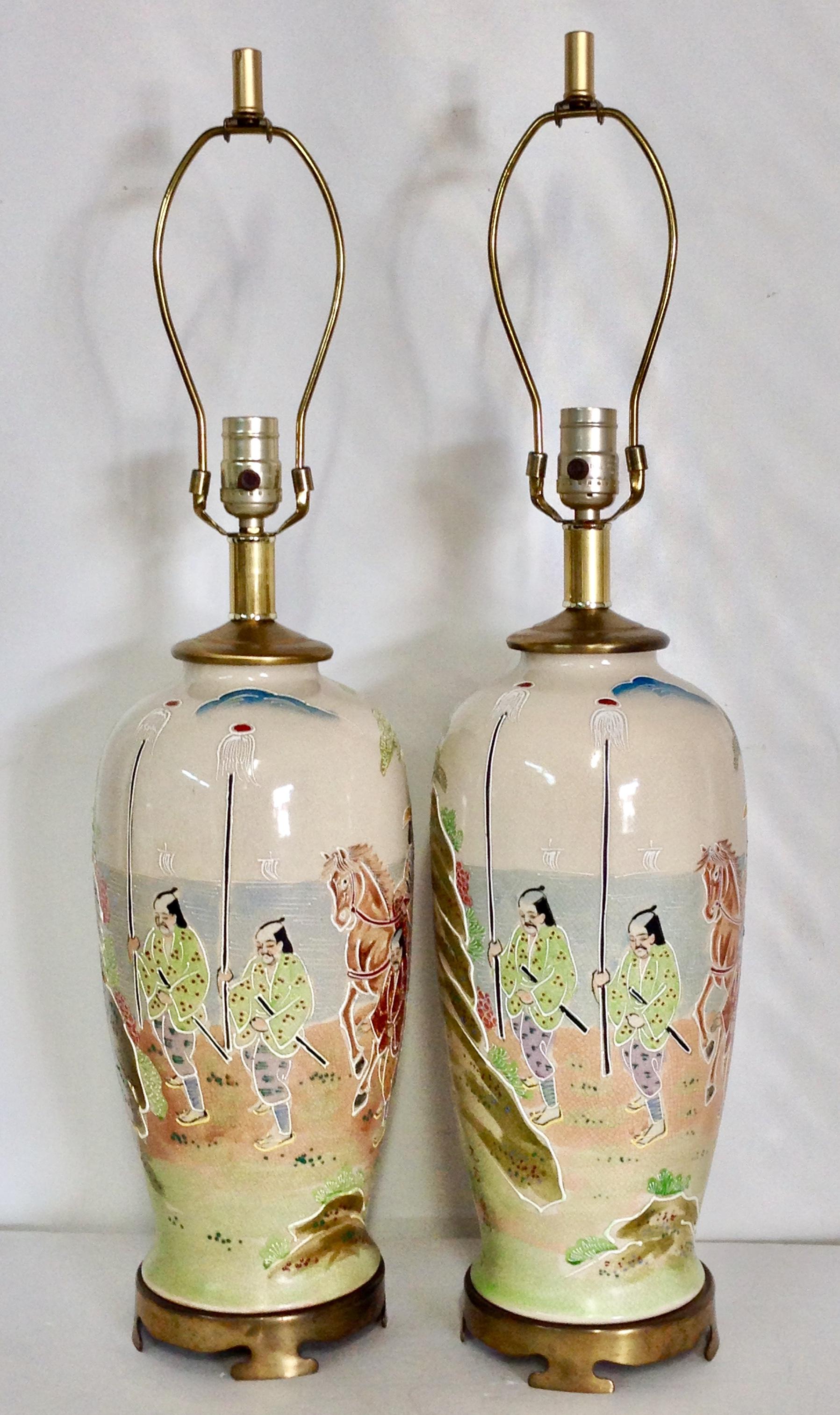 20th Century Pair Of antique Japanese hand painted porcelain Satsuma Moriage Crackle  lamps on the original brass bases in the style know as Kyoto Satsuma. Each lamp is signed on the body by the artist. Hand-painted with raised texture/moriage