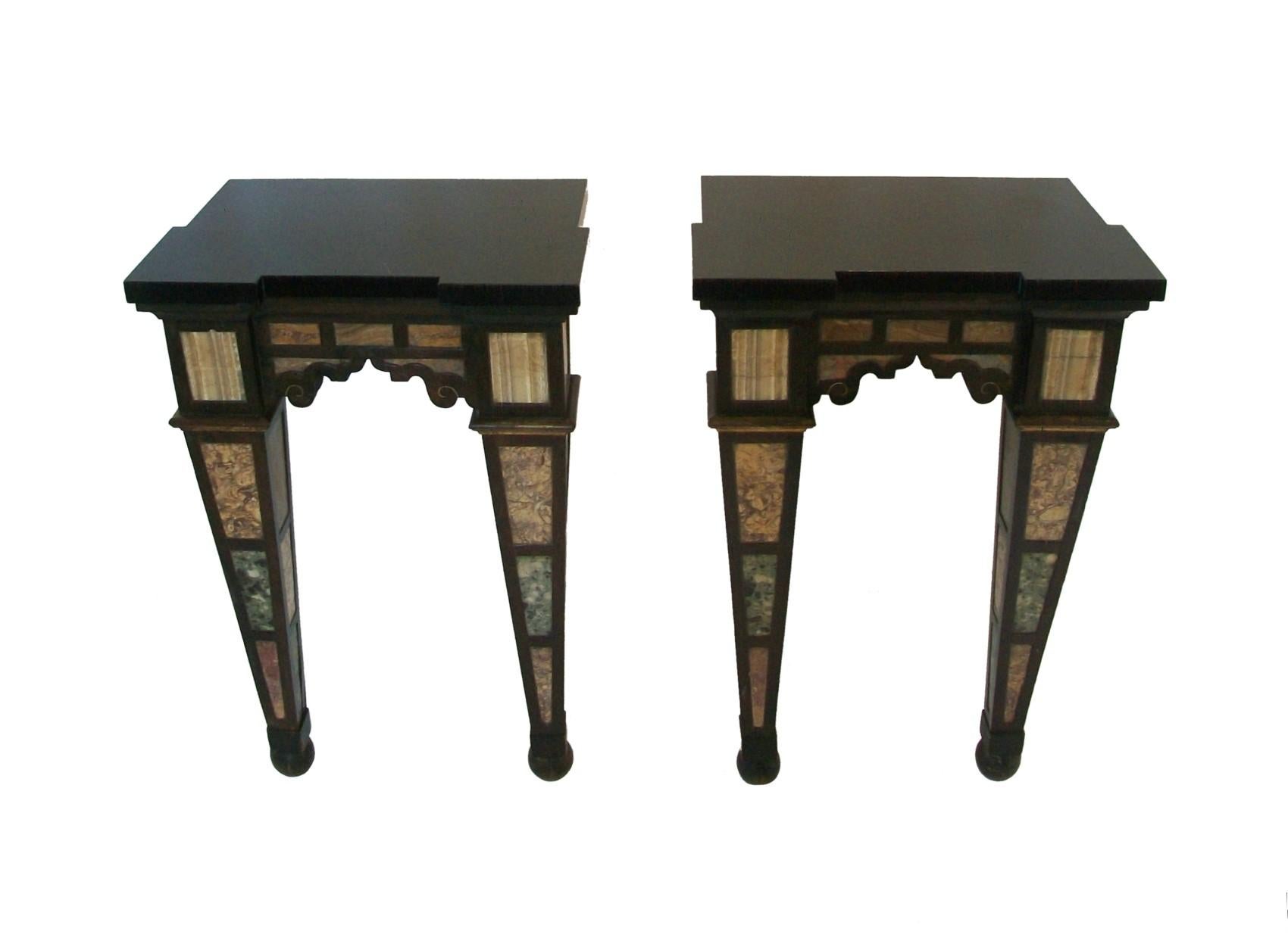 Rare pair of antique specimen marble console tables - featuring a variety of inset marbles and onyx to all sides within a tooled hardwood frame - each leg a reverse obelisk terminating on a ball foot, all four sides of the legs finished (important