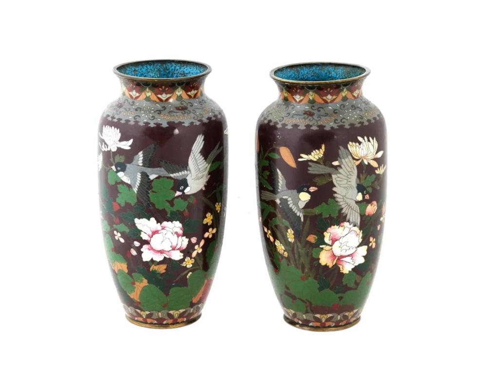 A pair of large Japanese copper vases with cloisonne enamel design. Late Meiji period
. Elongated shape with pronounced neck. The body of both pieces is decorated with polychrome cloisonne enamel design depicting peony flowers and birds on a