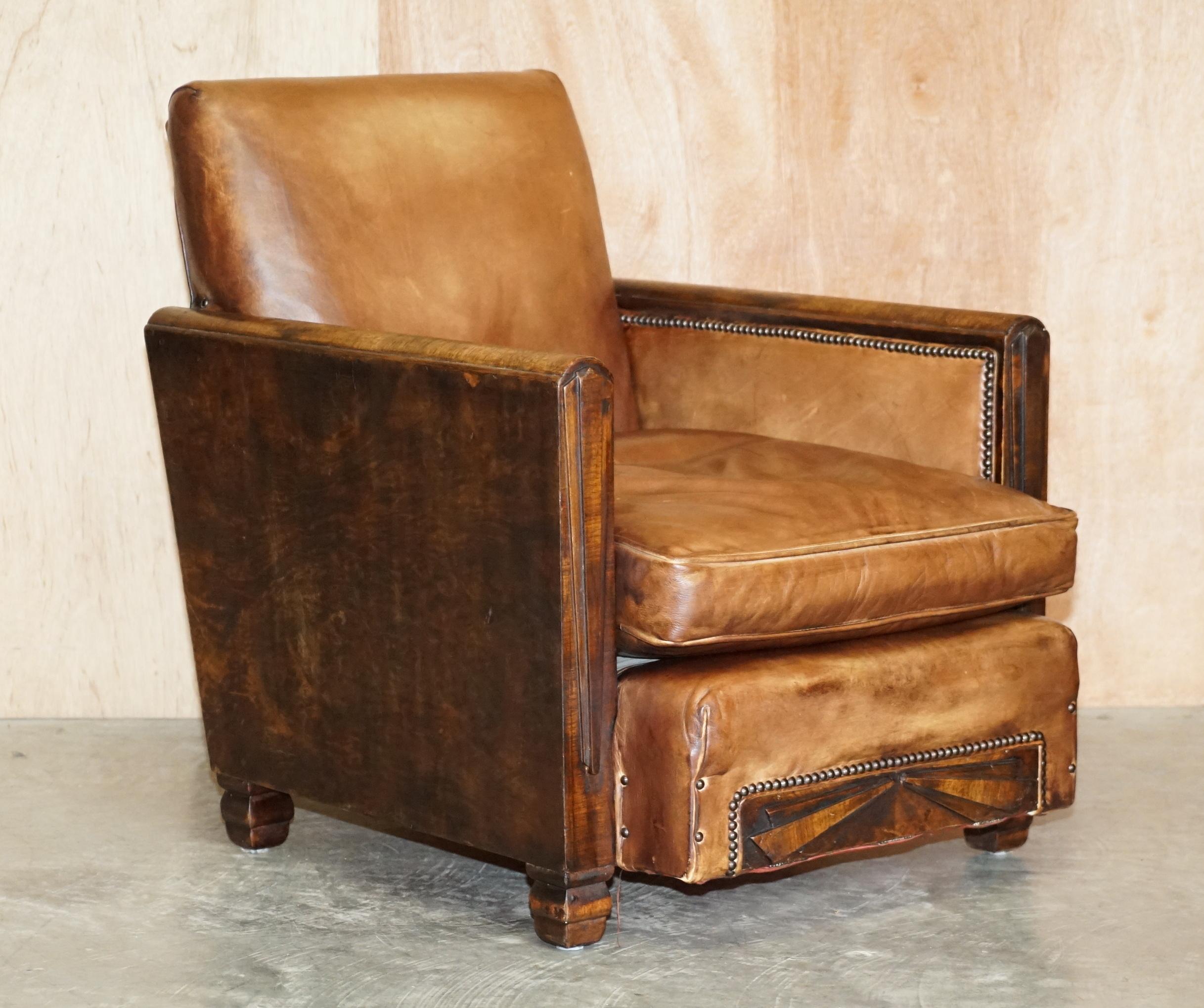We are delighted to offer for sale this stunning pair of restored Metropolitan Art Deco hand dyed brown leather club armchairs 

These are very stylish pair of antique club armchairs with walnut frames, the pillars of the arms and extended seat