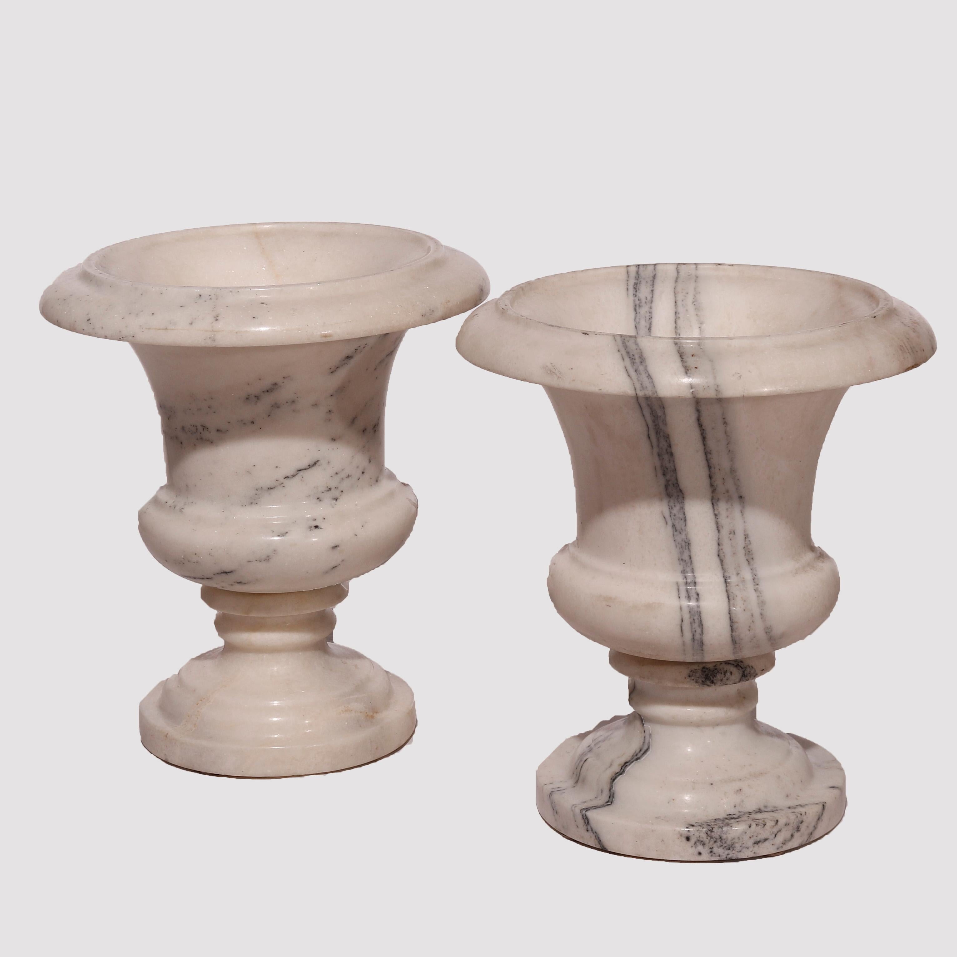 An antique pair of Neoclassical garden urns offer carved marble construction, 19th century

Measures - 17.75H x 15.75