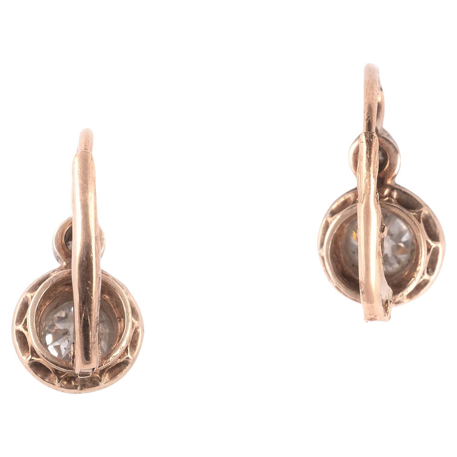 Pair of antique 18 kt gold and silver diamond earrings, approx. 1850/60s, 18kt yellow and silver, diamonds significant for the period in silver setted, settings a jour, 2 diamonds total approx. 0.80 ct and, 2 diamonds total approx. 0.10 ct. approx.