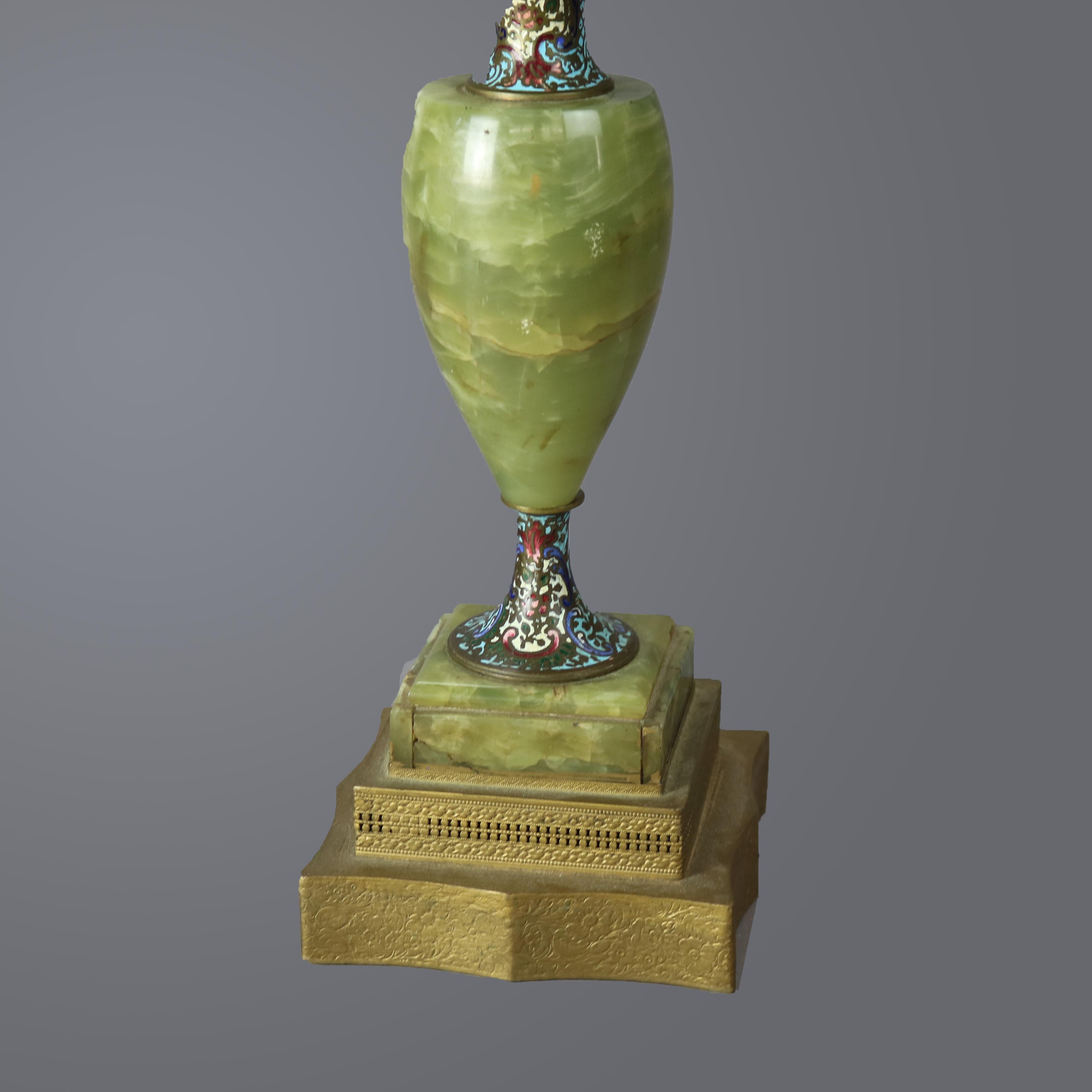 An antique pair of table lamps offers onyx urn form base with champleve neck and pedestal, c1920

Measures - 26.5