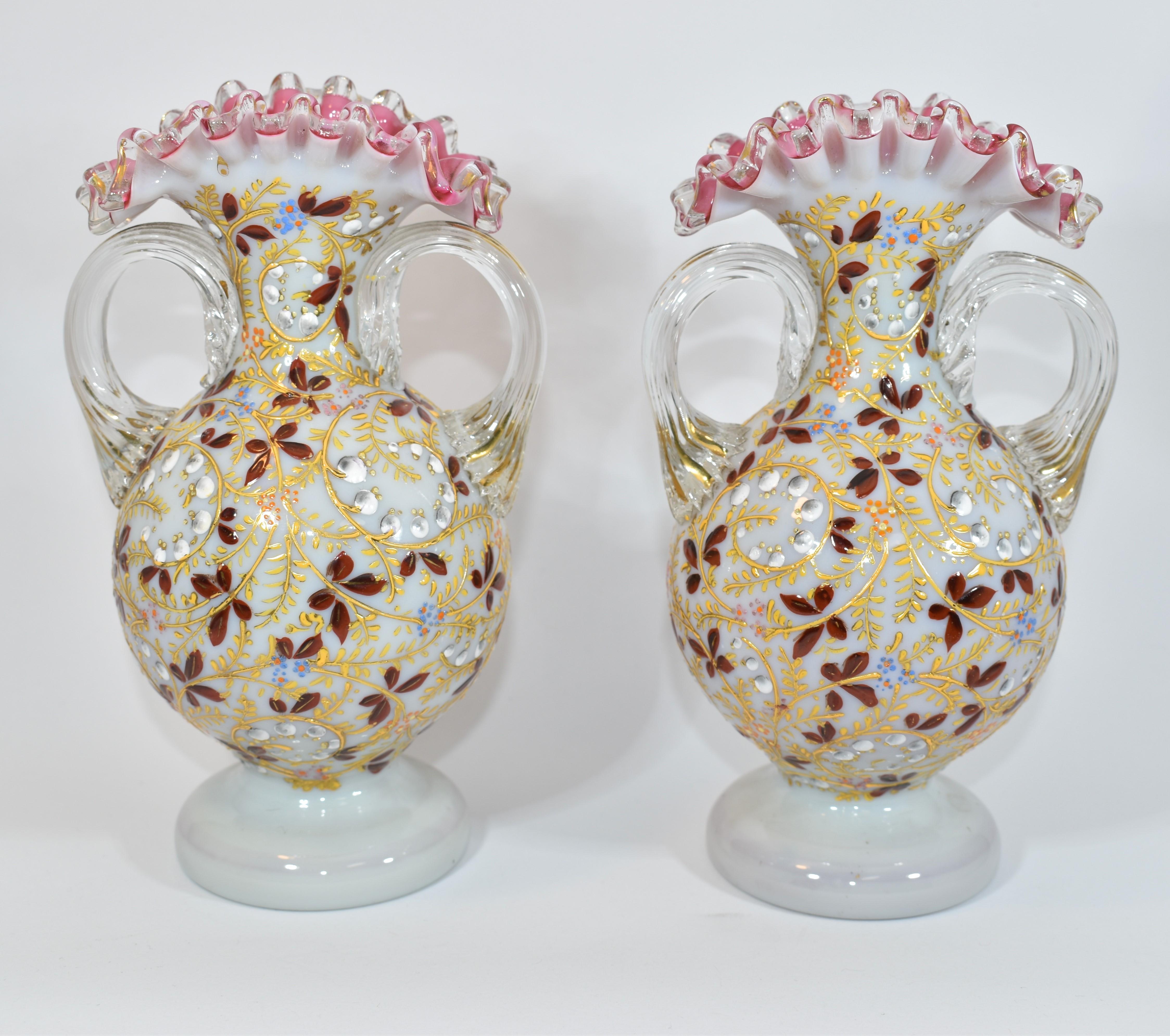 Pair of flared vases with handles
made of two-tone opal glass, pink and milky white
stunning wavy edges
hand-painted all around with colorful enamel
Bohemia, Moser, late 19th century.