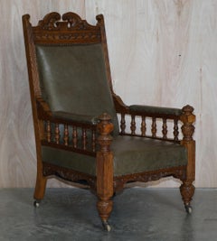 Antique Pair of Ornately Carved Oak Framed Leather Victorian Throne Armchairs