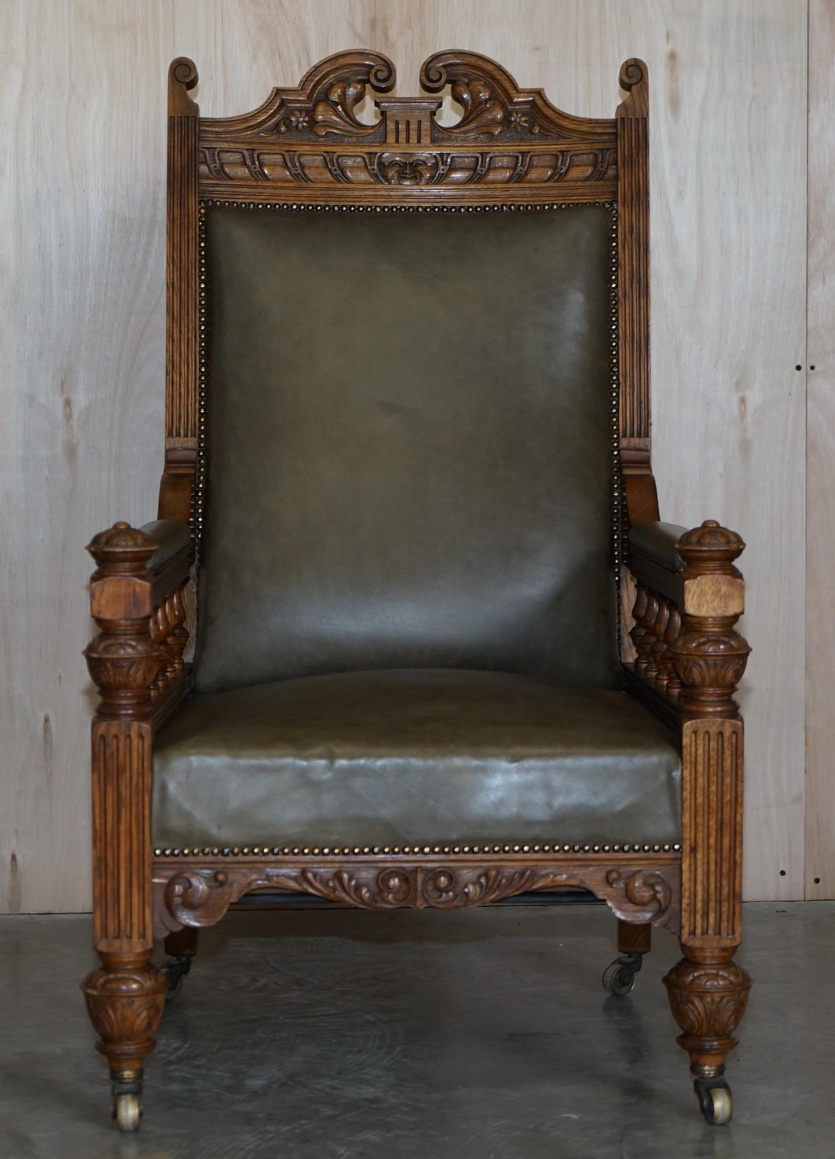 English Antique Pair of Ornately Carved Oak Framed Leather Victorian Throne Armchairs For Sale