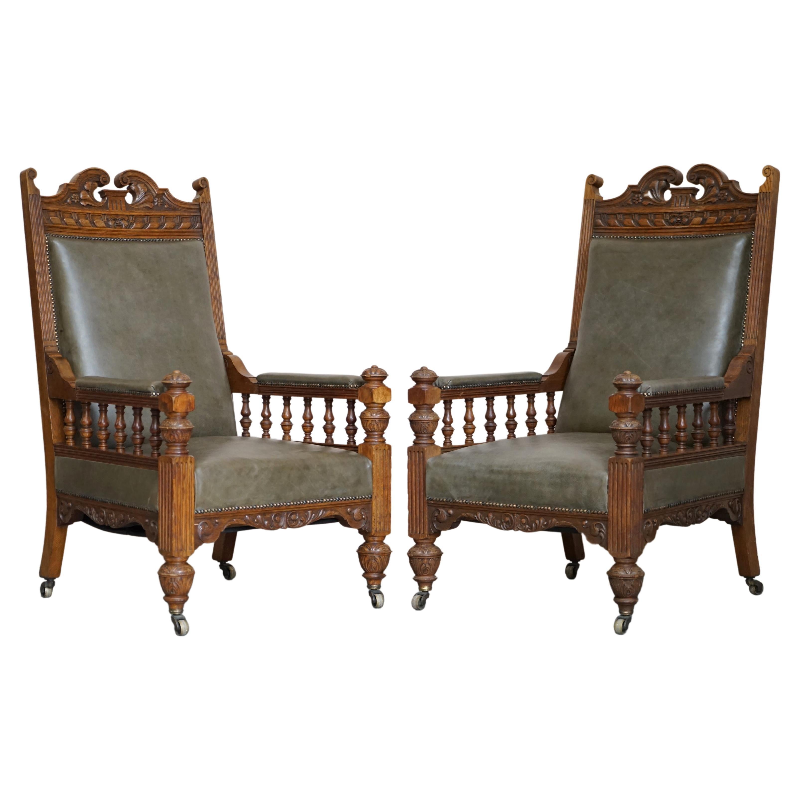 Antique Pair of Ornately Carved Oak Framed Leather Victorian Throne Armchairs