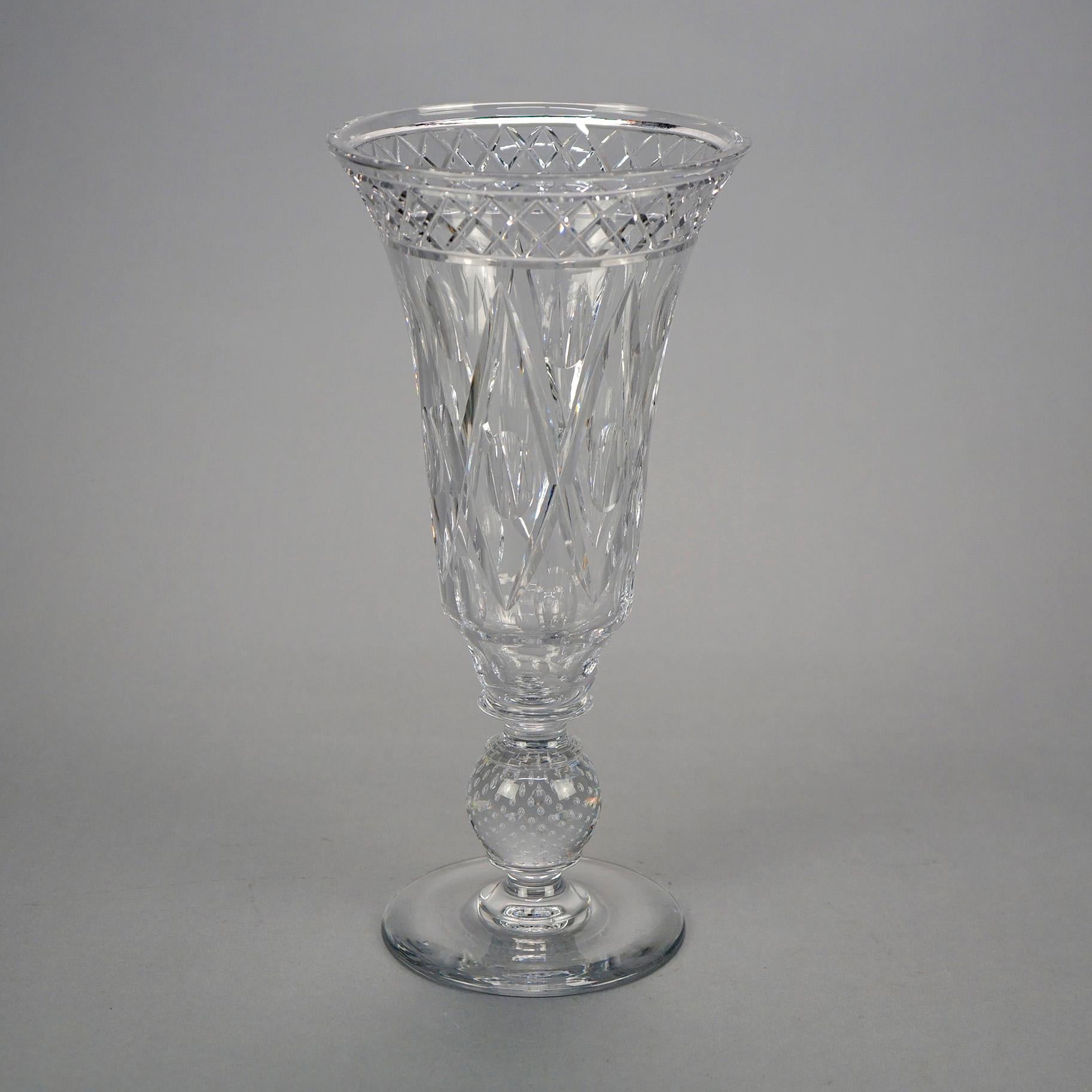 An antique pair of vases by Pairpoint offers art glass in flared form with diamond cut design raised on bubble glass ball form stem, signed as photographed, c1910

Measures- 13.25'' H x 6.25'' W x 6.25'' D.