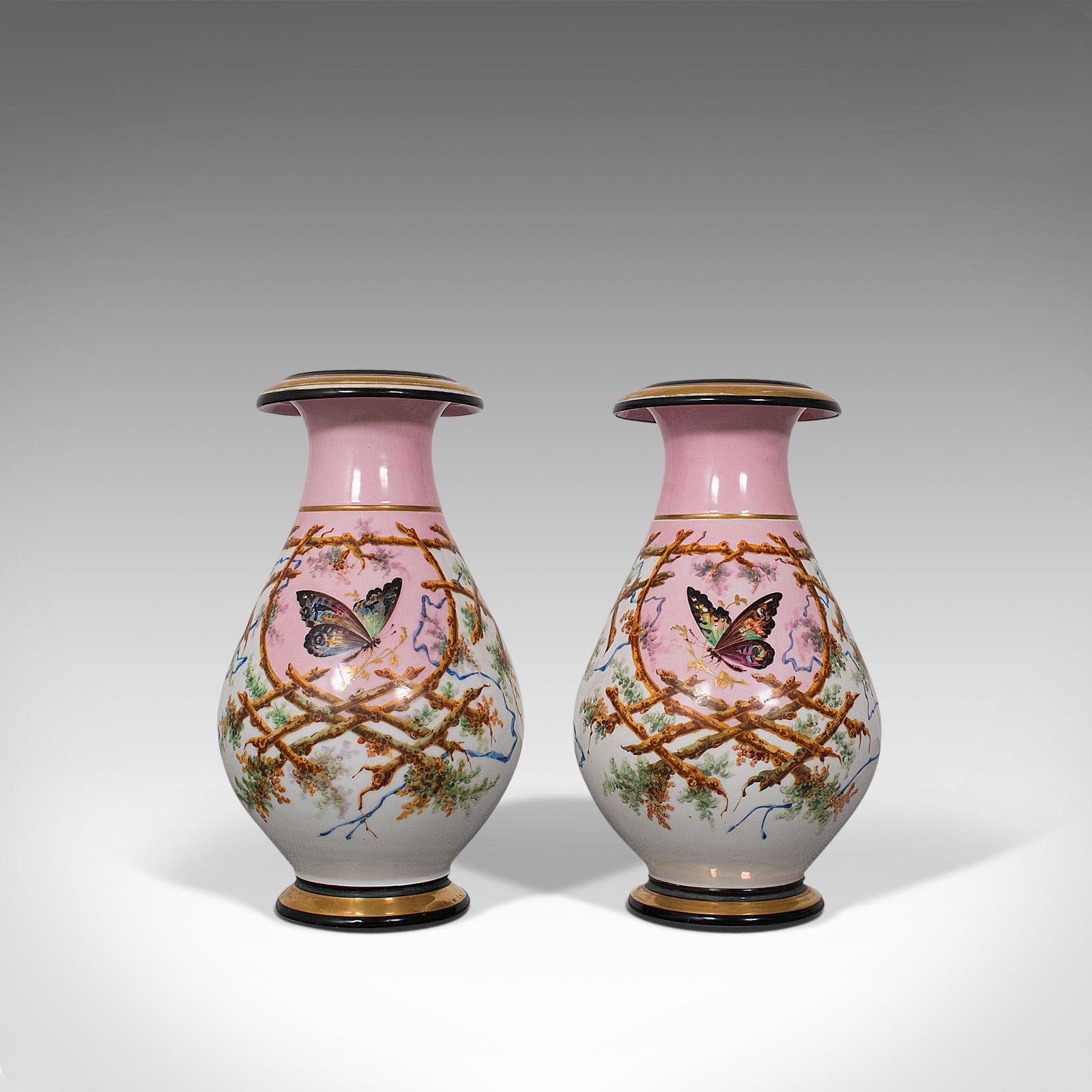 This is an antique pair of peony vases. A French, decorative ceramic baluster urn adorned with butterflies, dating to the late Victorian period, circa 1890.

Wonderfully decorative antique French vases
Displaying a desirable aged patina, superb