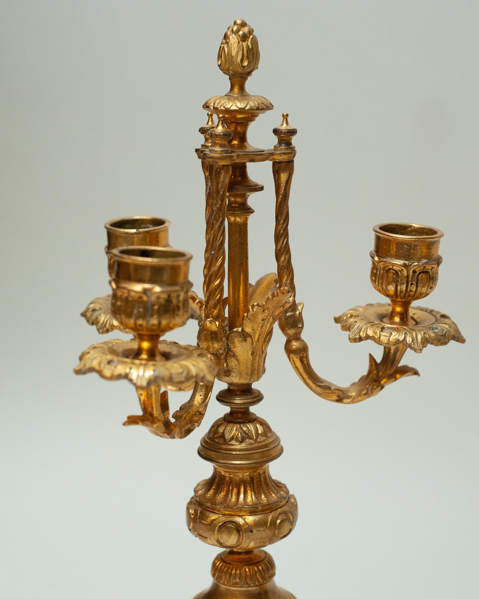 An exquisite pair of Antique pink porcelain and bronze candlesticks with gilt wood base, circa 1890.