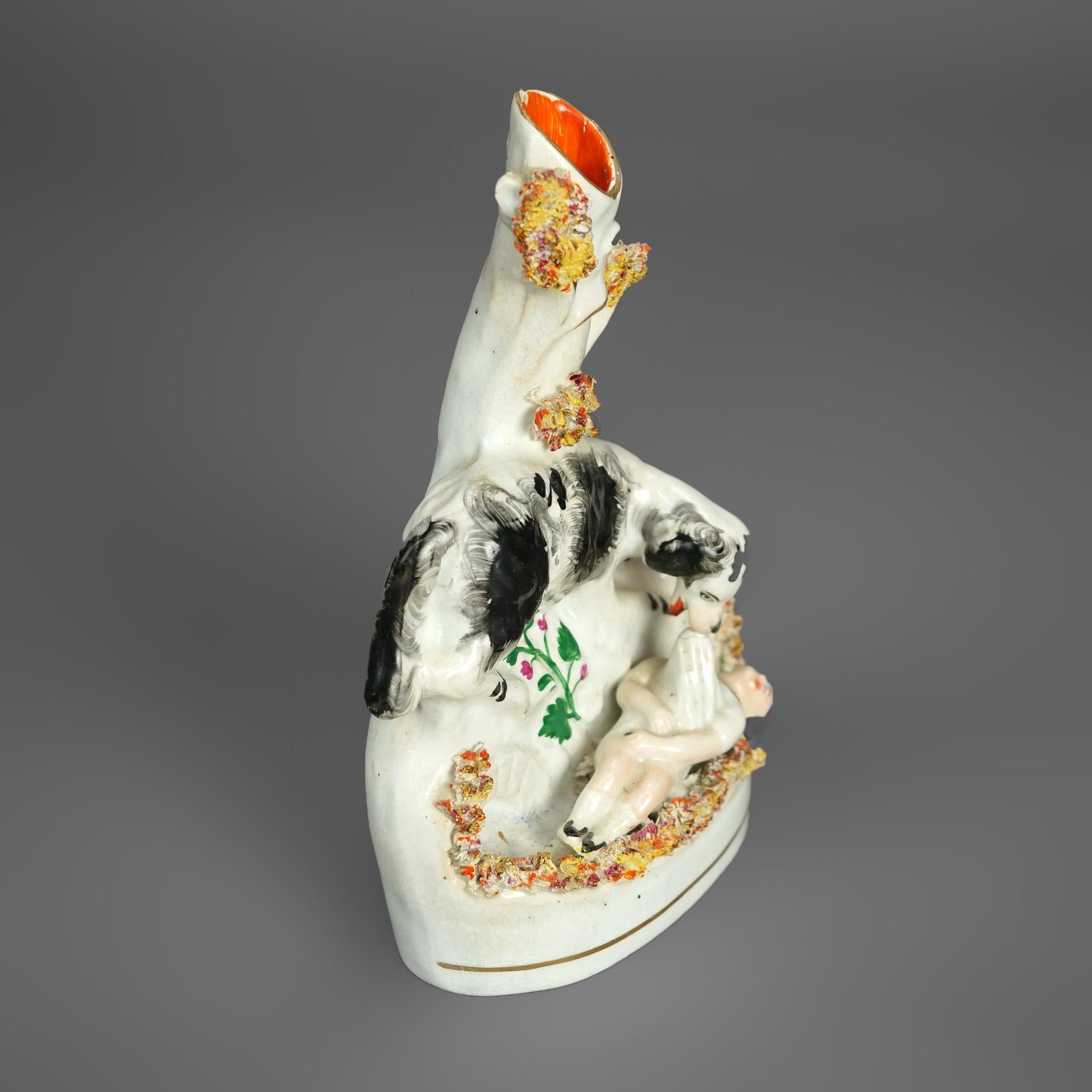 An antique pair of spill vases offer porcelain construction with hand painted and gilt figures of a playful child and Newfoundland (dog) in an outdoor setting, c1870

Measures- Right: 8''H x 5.25''W x 2.5''D; Left: 3''H x 5.25''W x 3''D