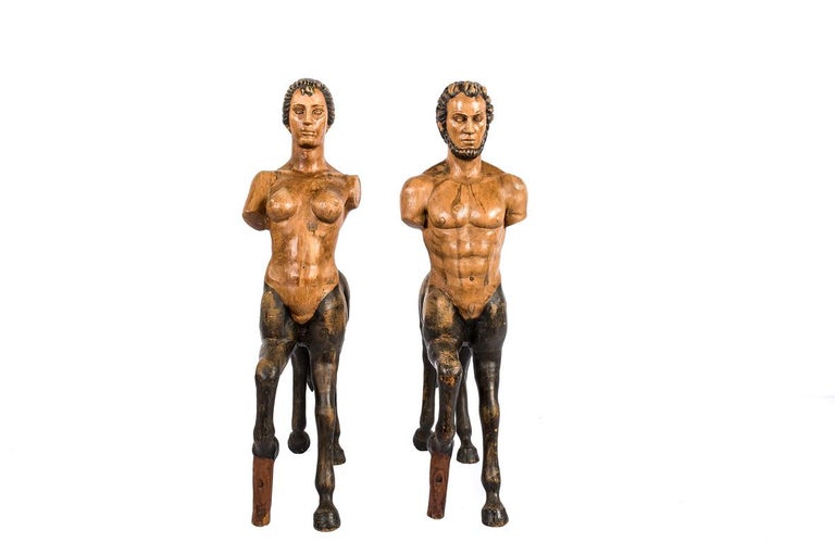 An antique lifesize pair of polychromed centaurs made in France in the early 20th century. 
It is both a male and a female centaur and they were made in solid pine. A centaur is a creature from Greek Mythology with the upper body of a human and the