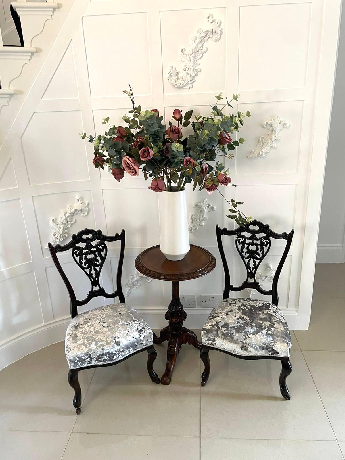 Antique pair of quality Victorian ebonised side chairs having pretty ornate pierced shaped backs, newly reupholstered seats in a luxury grey crushed velvet fabric, elegant cabriolet shaped legs to the front and out swept back legs with original