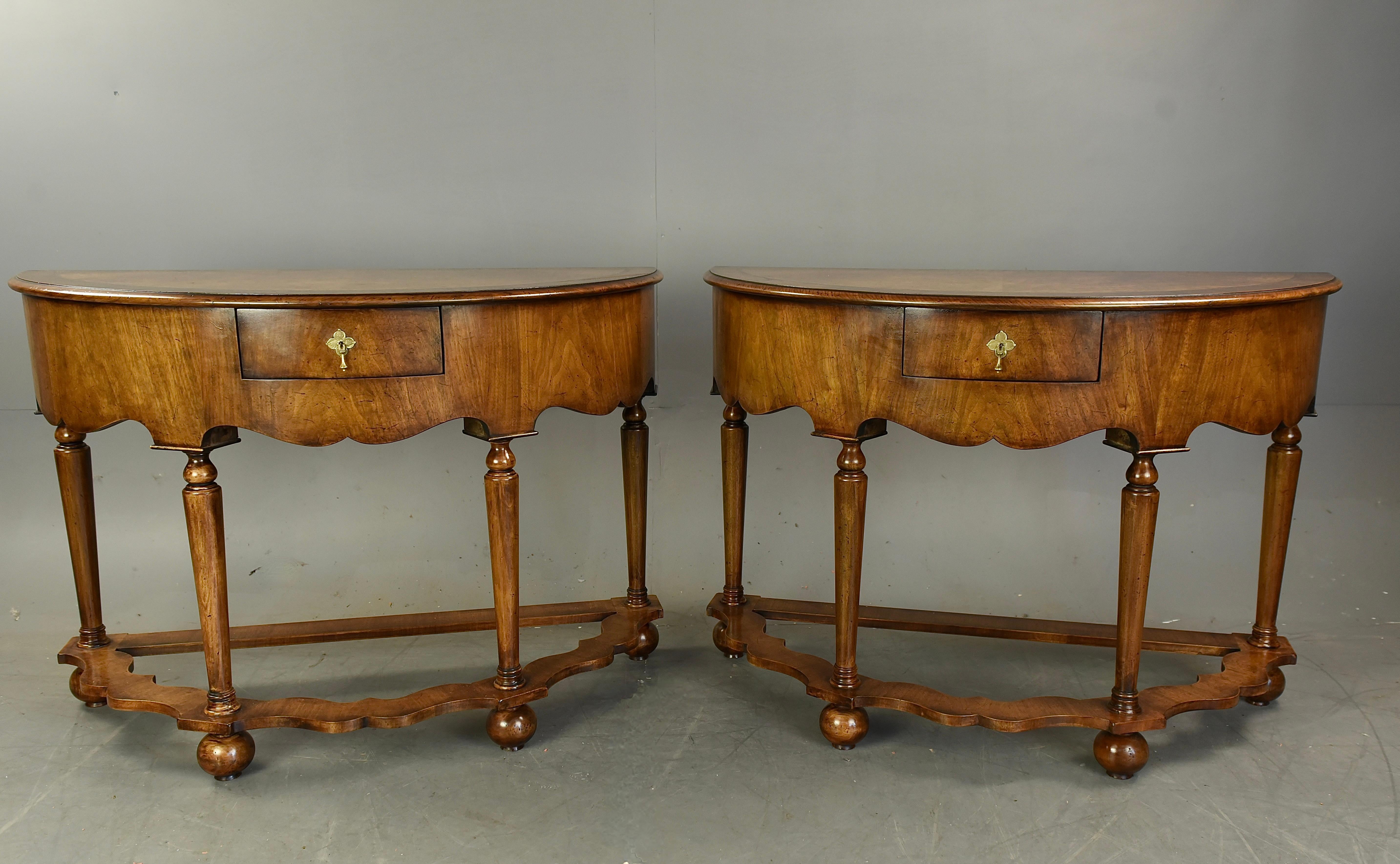 Very good quality pair of walnut Demi lune console tables circa 1900.
They have wonderful Burr walnut tops with walnut and feather edge banding ,each console have a small oak lined hand dovetailed drawer ,with a wonderful grained deep frieze