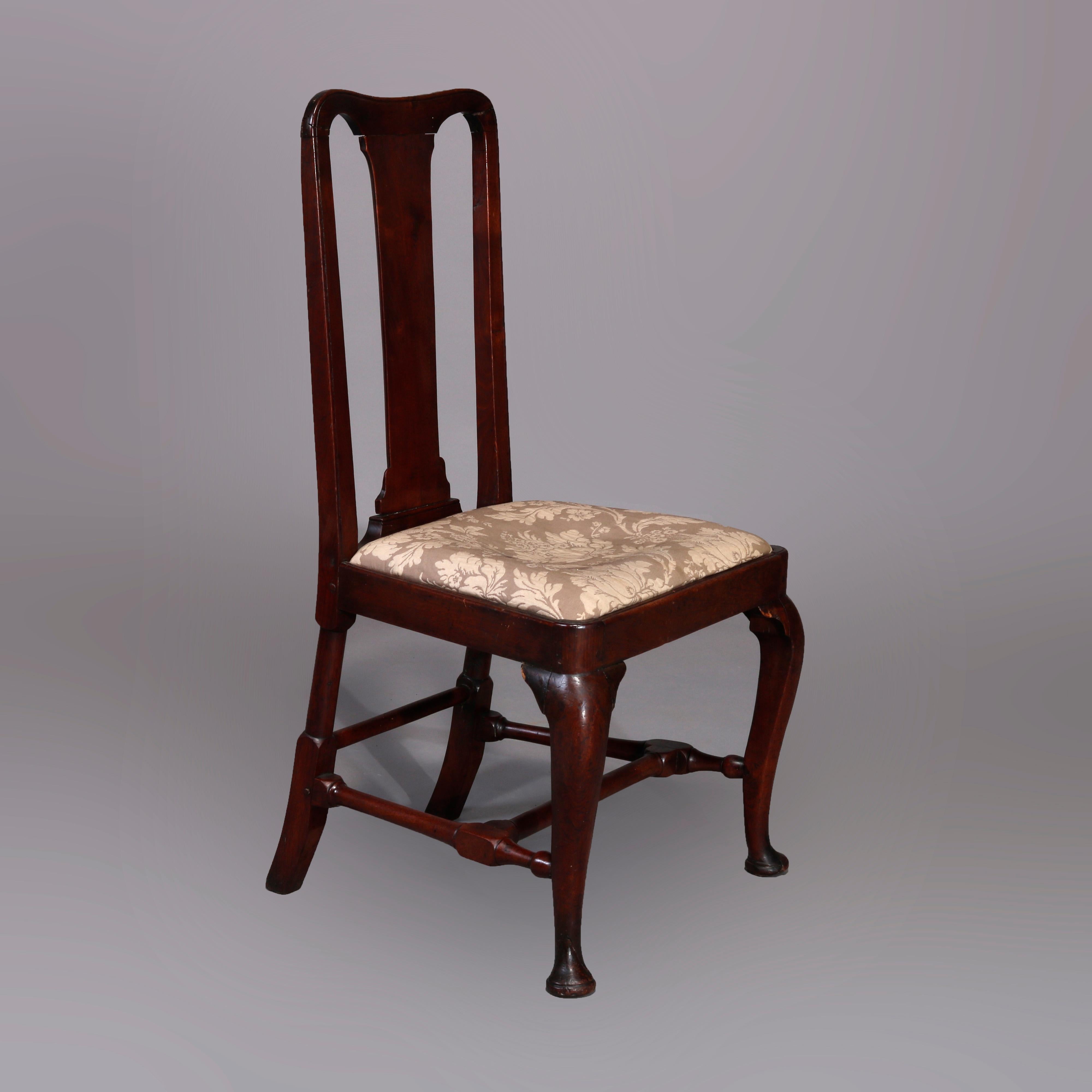 An antique pair of Queen Anne side chairs made in New England offer carved mahogany construction with slat backs, upholstered seats, raised on cabriole legs with pad feet, circa 1760

Measures: 1st chair 38.25