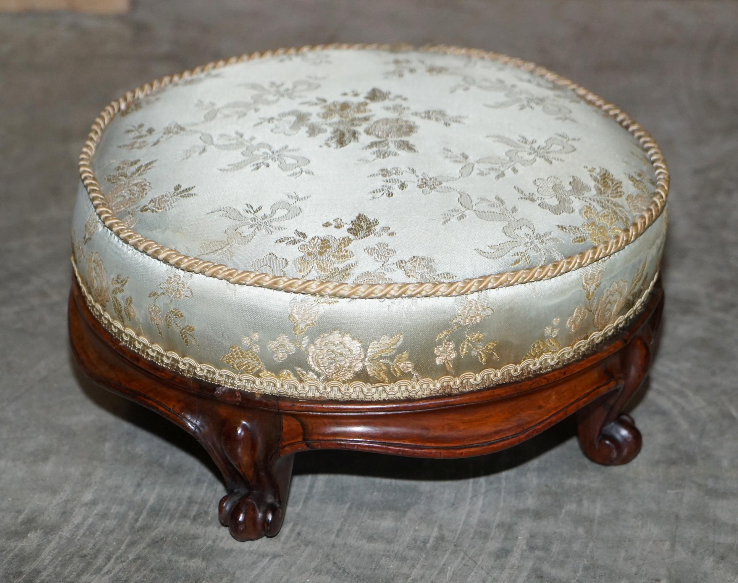We are delighted to offer this very nice early pair of Regency Rosewood footstools with silk embroidered upholstery 

A good looking and well made pair. These types of stools were designed to be used with wingback armchairs, the idea being, when