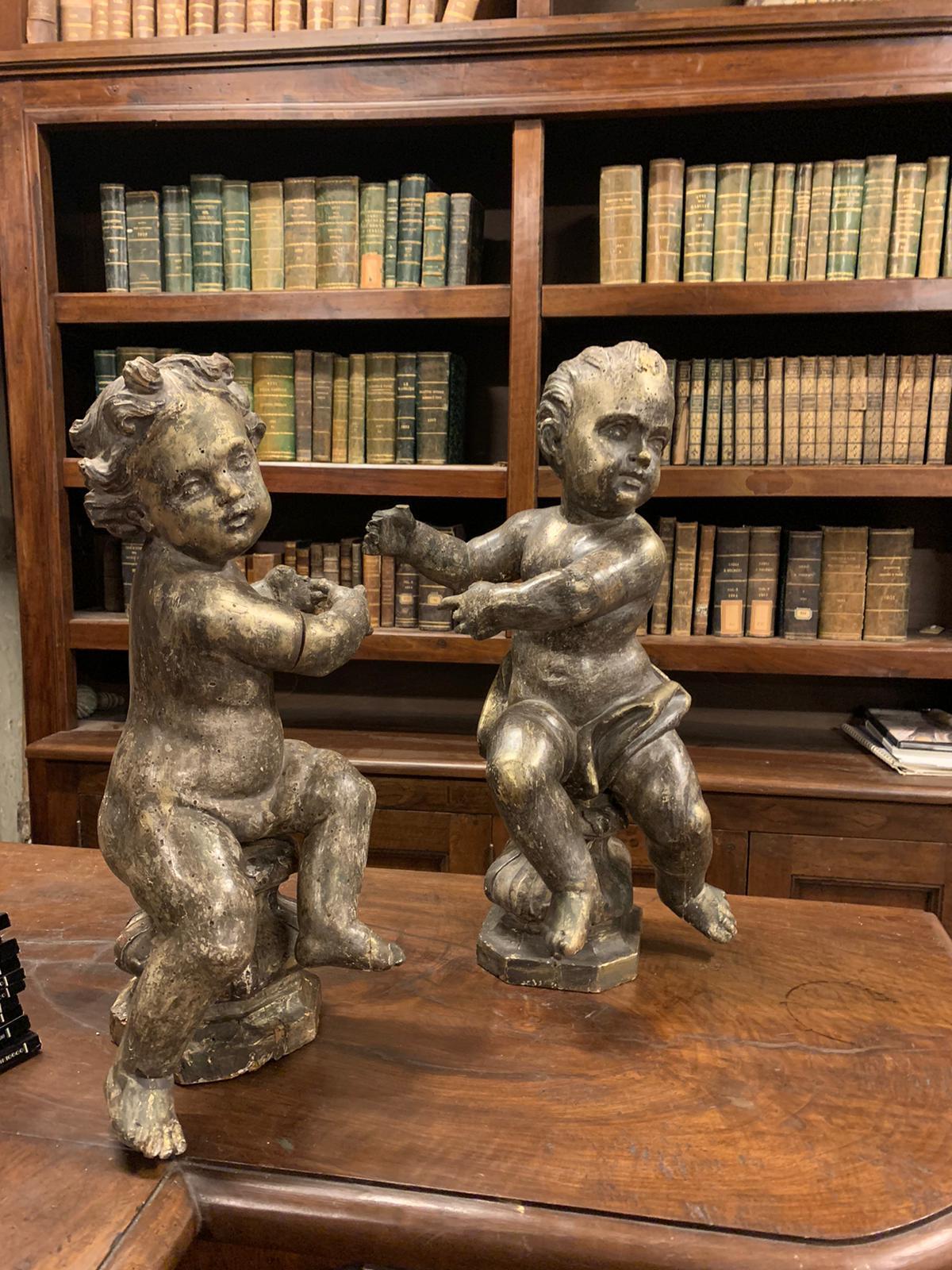 Italian Antique Pair of Sculptures, Cherubs Silvered and Gilded Wood, 18th Century Italy