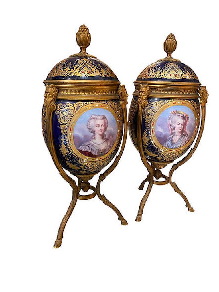 A pair of fine quality Napoleon III Sèvres ormolu-mounted porcelain vase, 1860. The gilt pinatum finial mounted lids above bodies with jeweled panels painted with four individual portraits of Fine young ladies. A panel of flowers to the reverse,