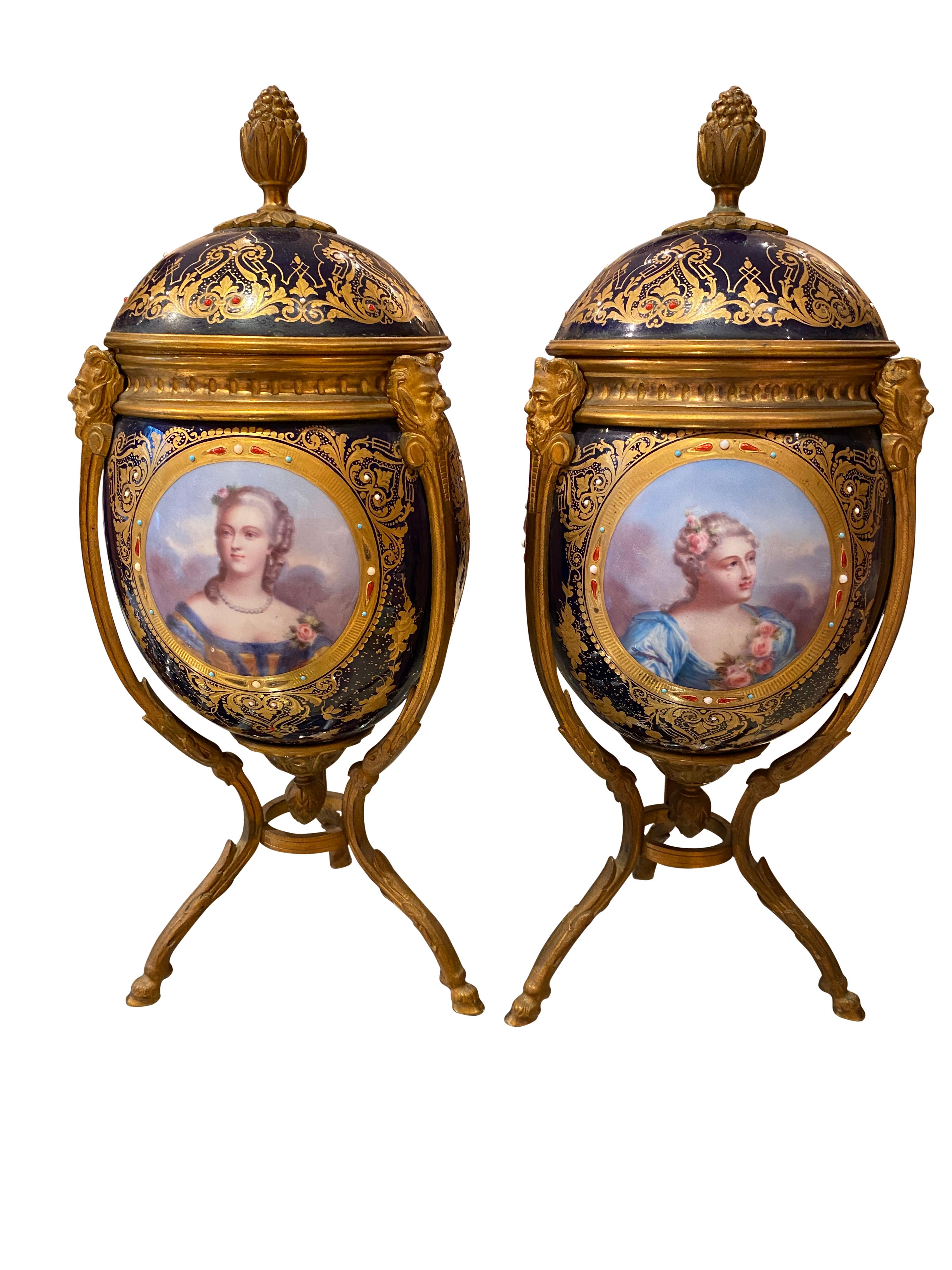 A pair of fine quality Napoleon III Sèvres style ormolu-mounted porcelain vase, 1860. The gilt pinatum finial mounted lids above bodies with jeweled panels painted with four individual portraits of Fine young ladies. A panel of flowers to the