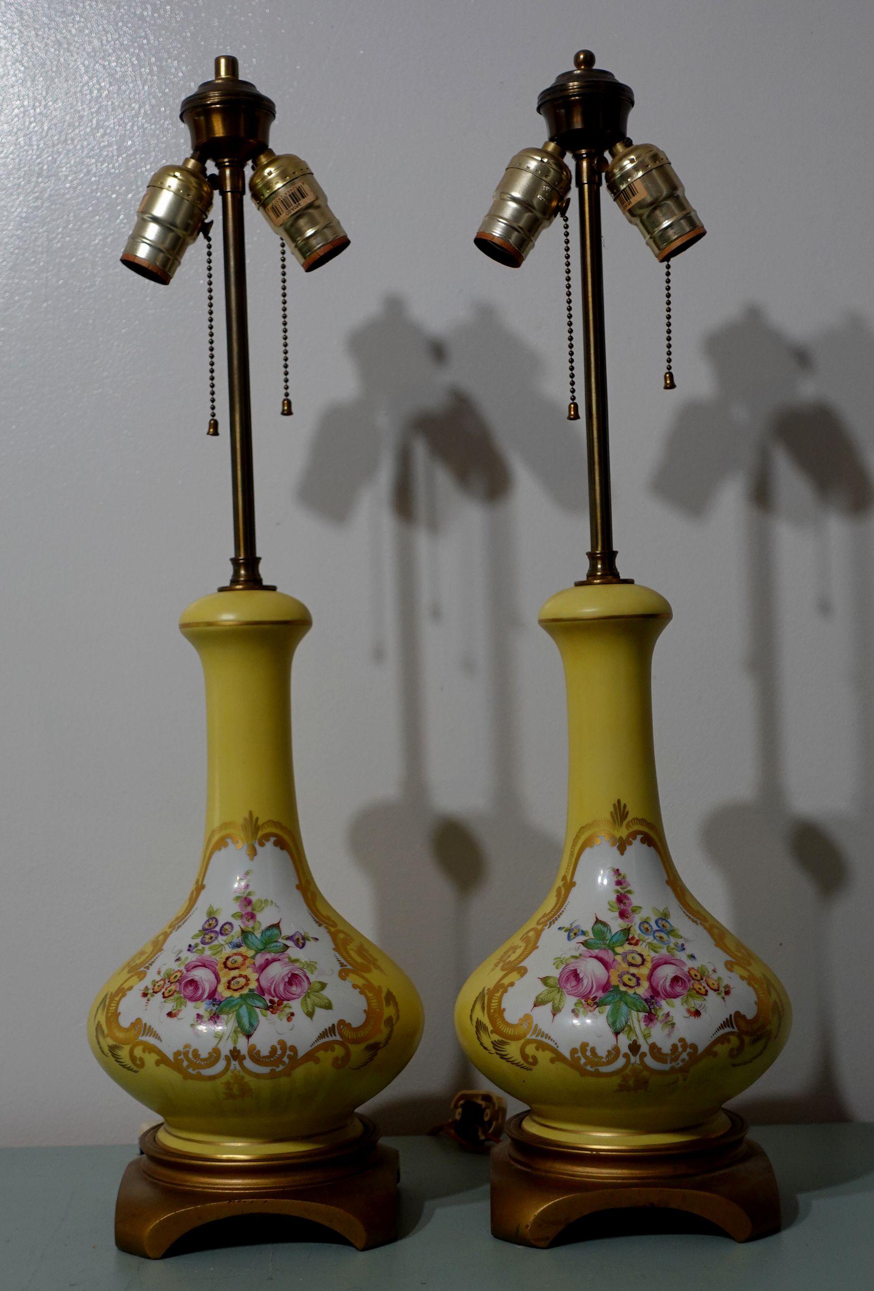 Early 20th Century
Beautiful pair of shapely porcelain body lamps decorated with central cartouche of pink roses and polychromatic flowers framed by gilt tendrils.
Good working condition, one light-switch cover lost.

Dimensions
Approx.26 1/2