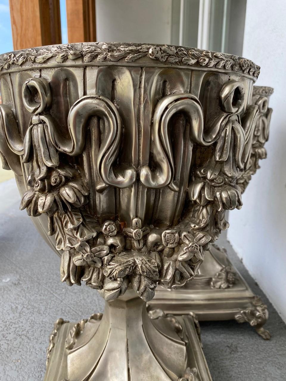 Cast Antique Pair of Silver Dipped Bronze Urns For Sale