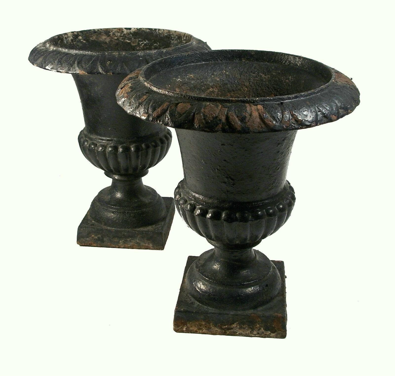Antique pair of small scale Campagna form cast iron garden urns - unsigned - United States - late 19th/early 20th century.

Excellent antique condition - no loss - no damage - no repairs - paint loss/surface grime & rust that comes with age and