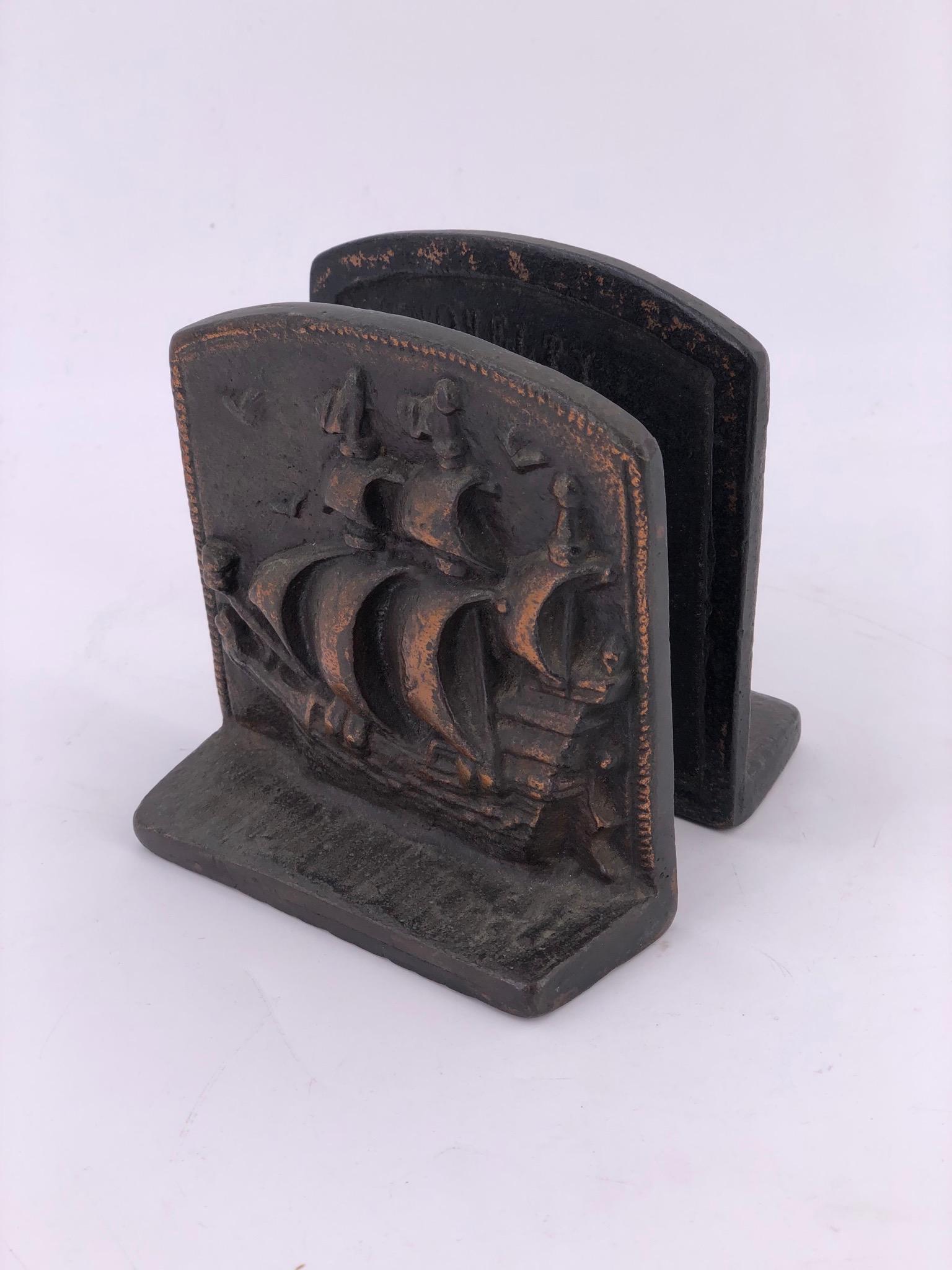 A rare pair of solid bronze bookends with a galley imprint, circa 1940s.