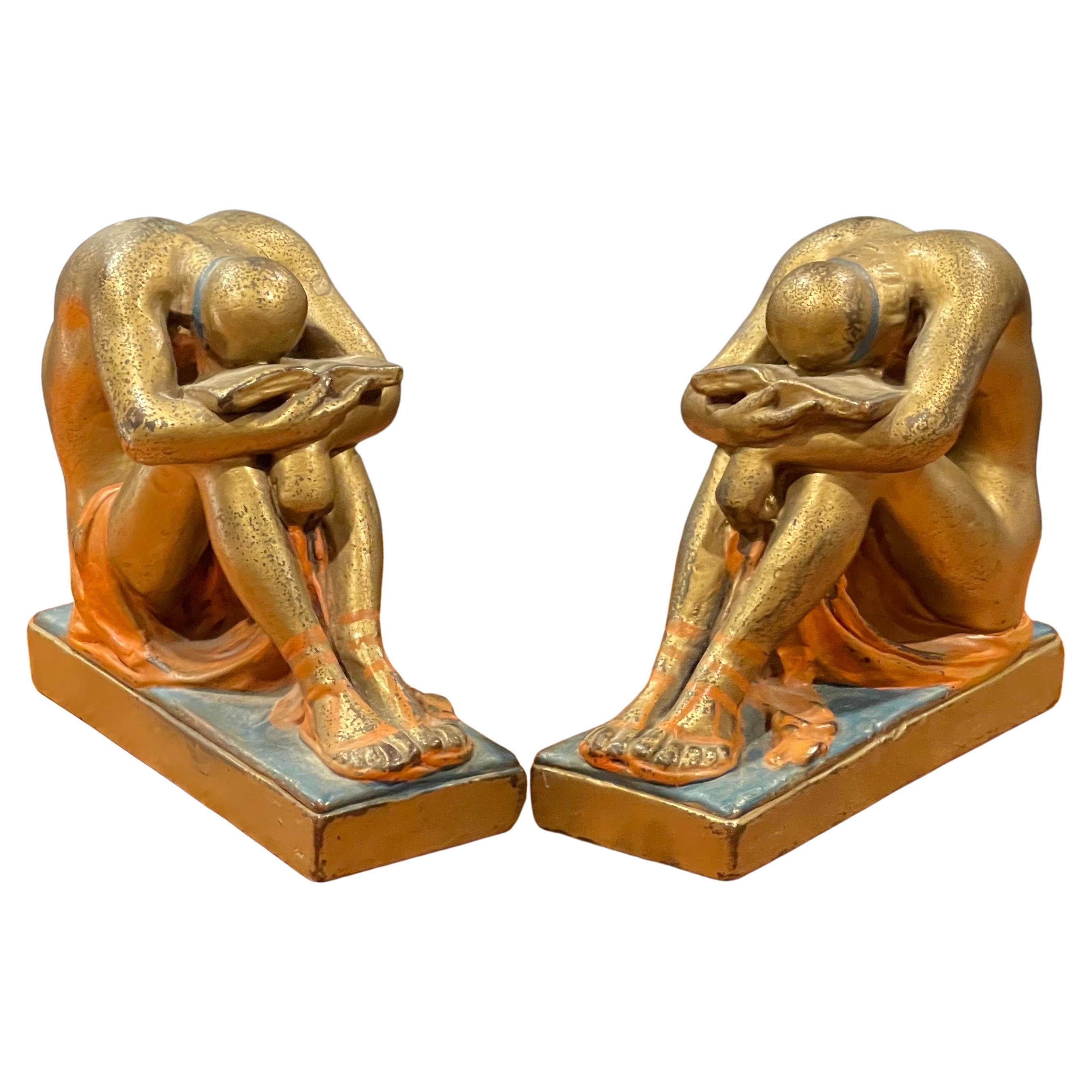 Antique pair of solitude / scholar bookends in polychrome bronze finish, circa 1940s. The pair have a great look, are quite solid and measure 11.25