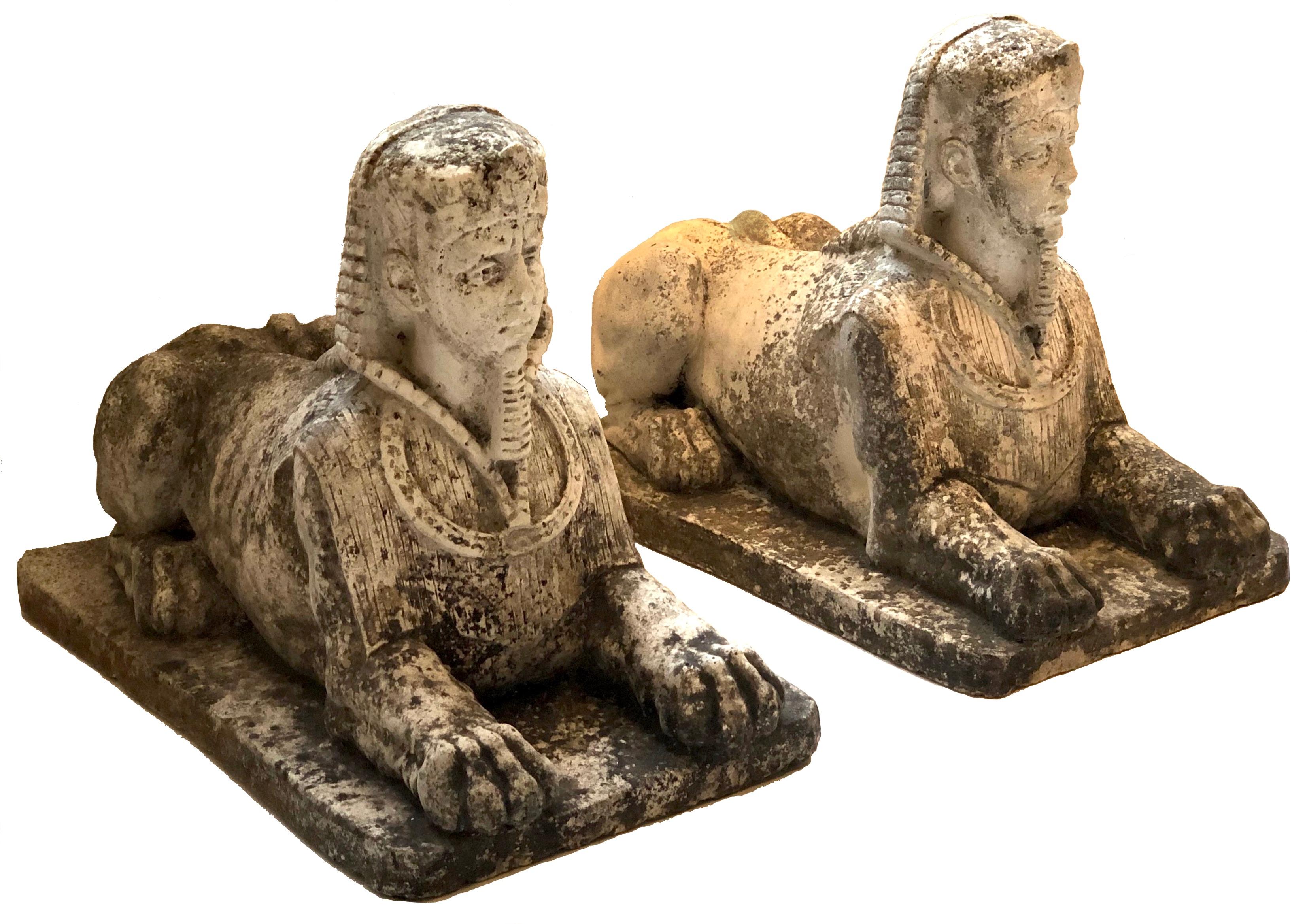 This pair of stylish garden ornaments is designed as sphinxes with the heads of pharaohs. They are seated on a rectangular base. They were made out of cast stone in Italy, earth 20th century. 

Measures: Length 44 cm.