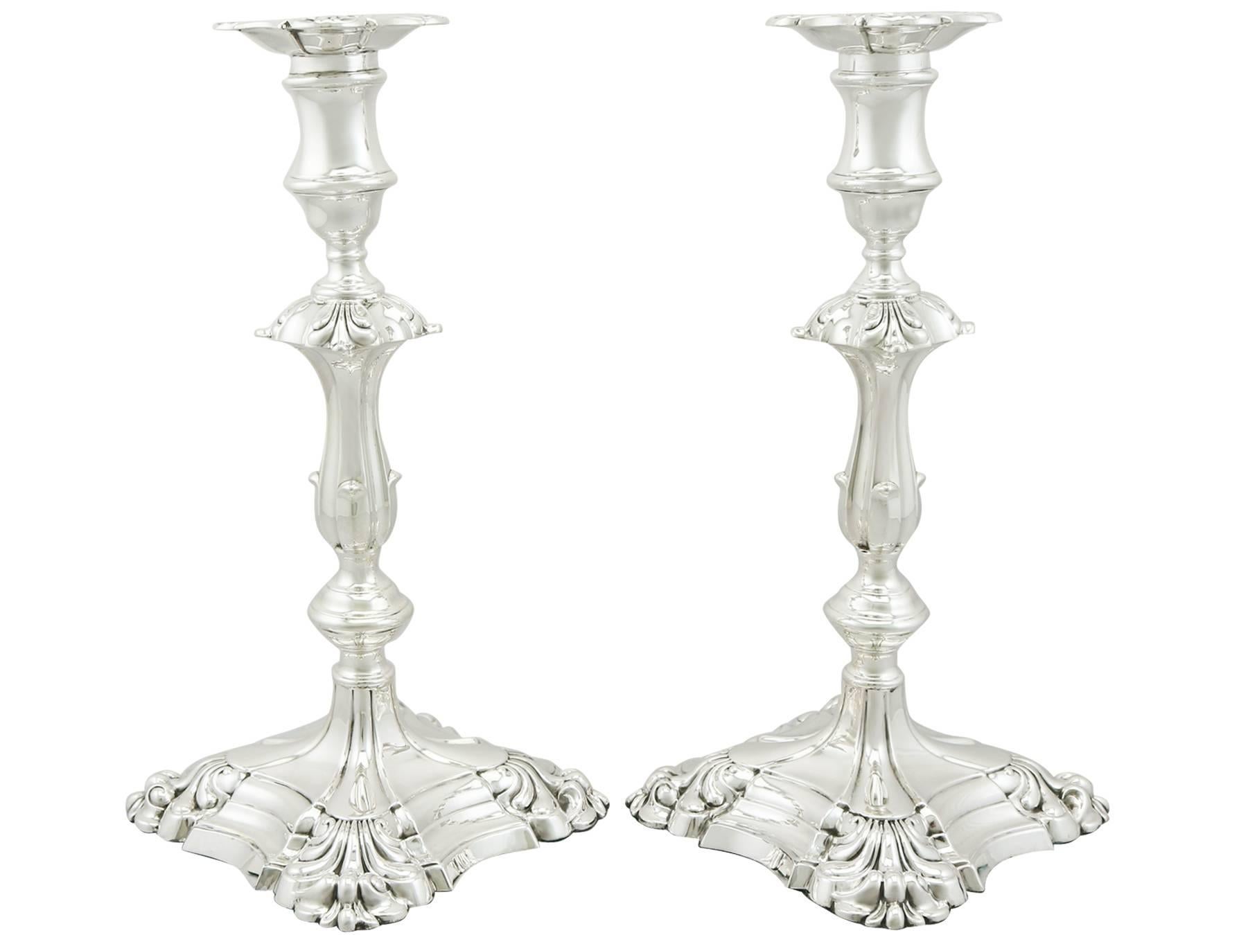 An exceptional, fine and impressive, large pair of antique George V English sterling silver candlesticks; an addition of our ornamental Georgian silverware collection.

These exceptional antique George V, large sterling silver candlesticks have a