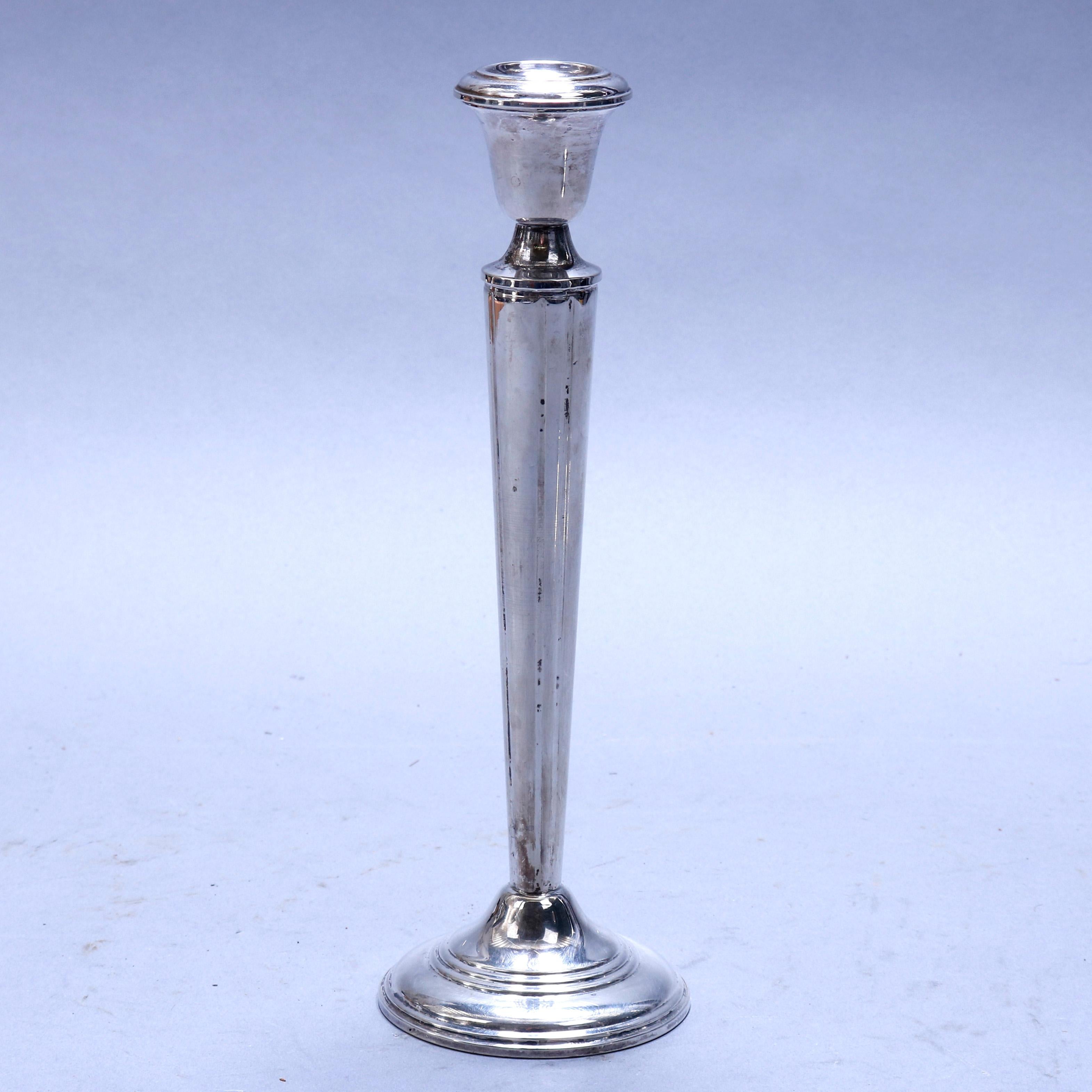 An antique pair of sterling silver weighted candlesticks, marked on bases as photographed, circa 1910

Measures: 10