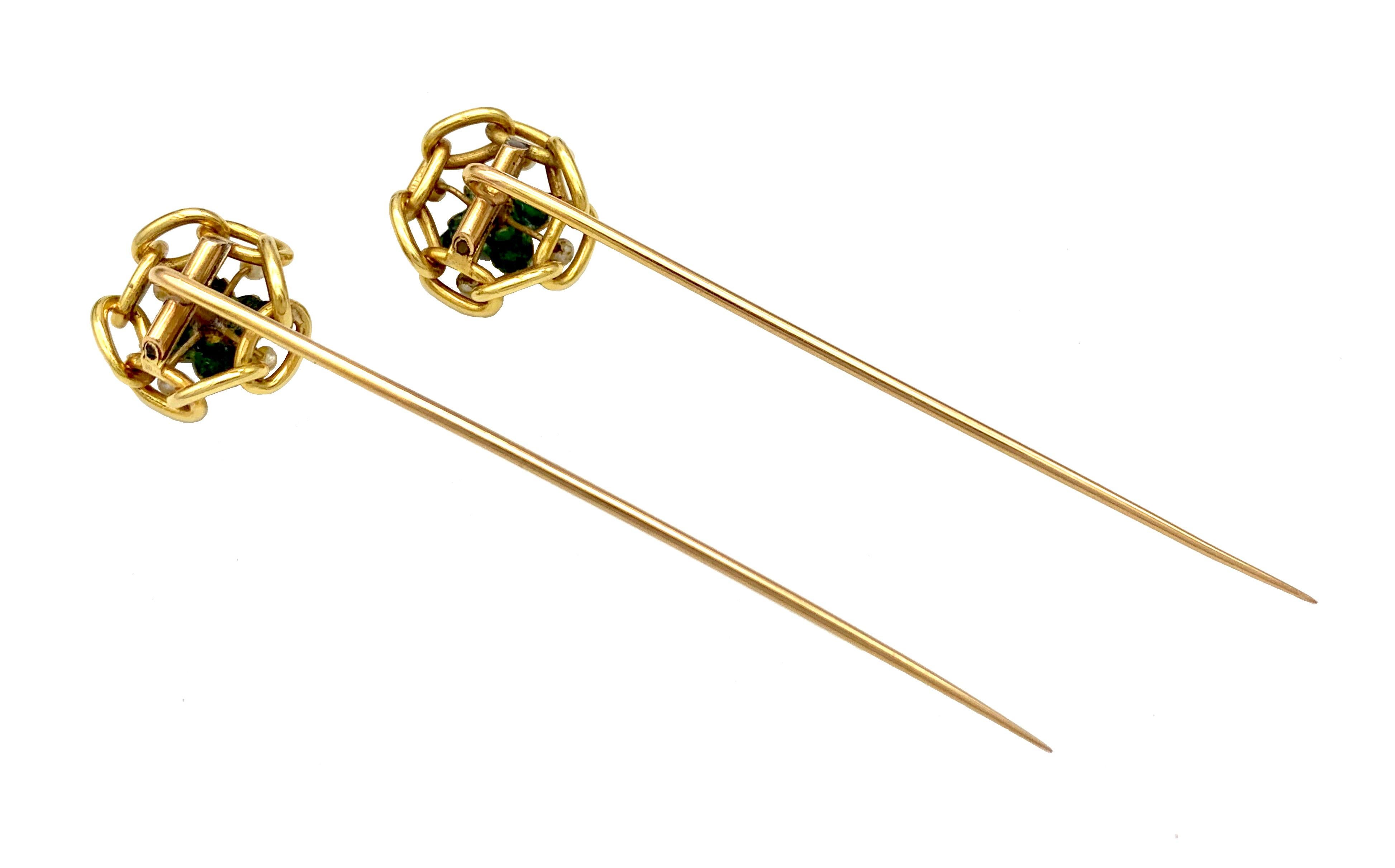 This graceful pair of stickpins was created in 1845 ca out of 18 karat gold. Each pin features a Flower with bright green enamelled flowers highlighted by  1 larger and four smaller oriental pearls each.