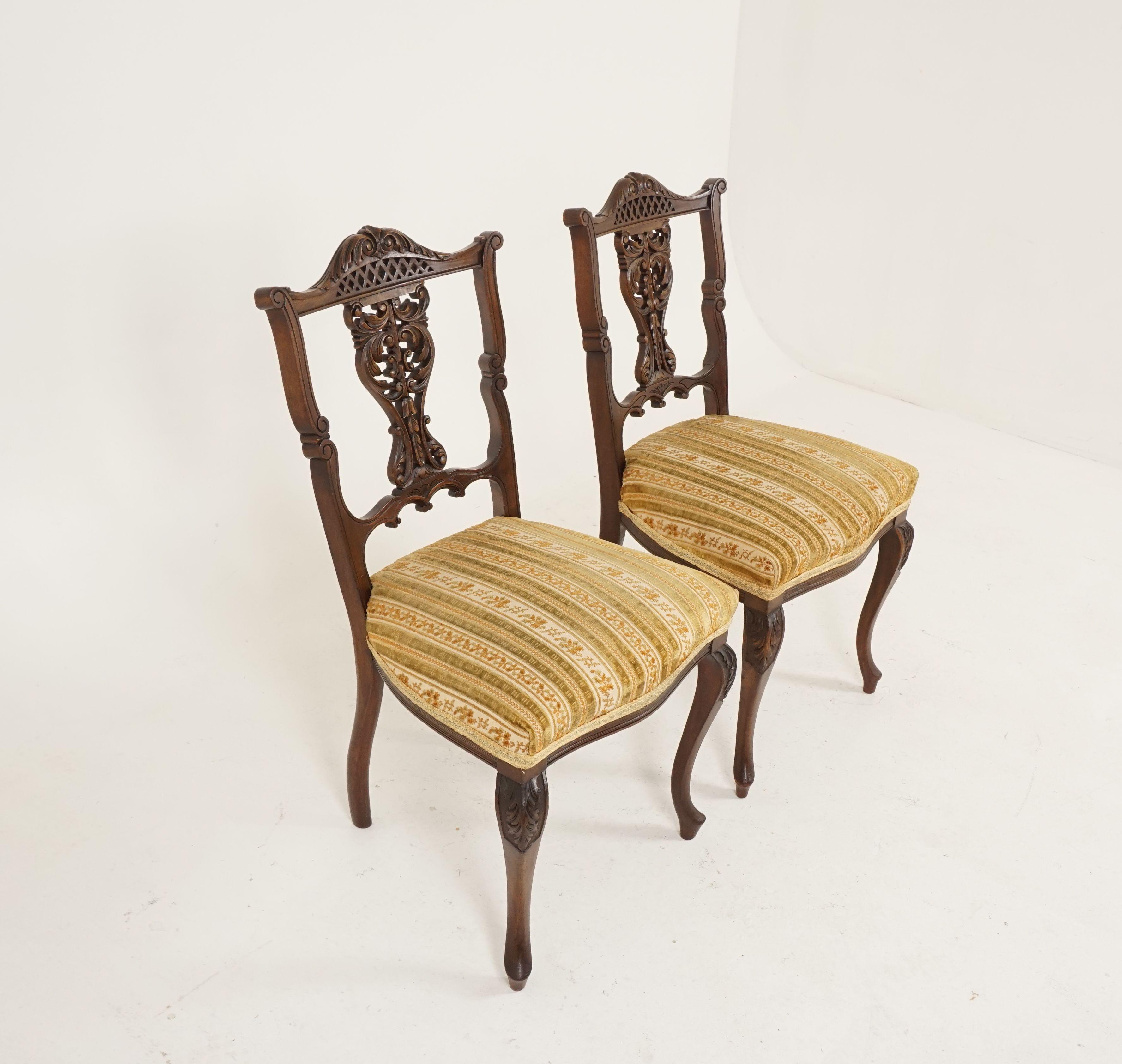 Antique pair of upholstered Walnut parlour or side chairs, Scotland 1900, B1364

Scotland 1900
Solid Walnut
Original finish
Very attractive top rail and carved center splat
Upholstered seat in a cotton fabric
They are raised on tall carved cabriole