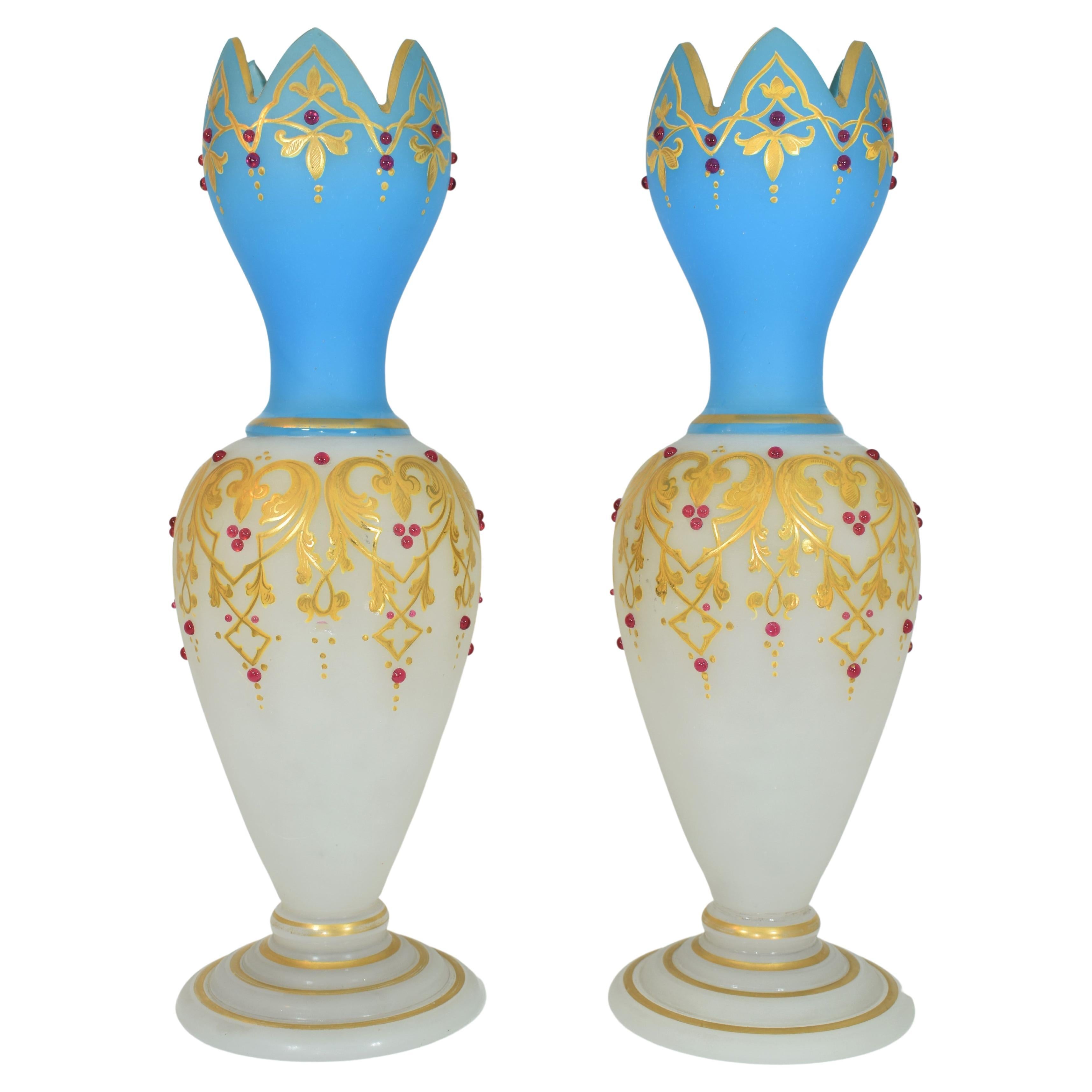 Hand-decorated with gold, enamel, and jewels! White and blue opal glass, each vase is raised on circular flat foot which is shaped in multiple gilded circles, finely applied red jewels on the circural body, richly hand-painted with enamel and 24k