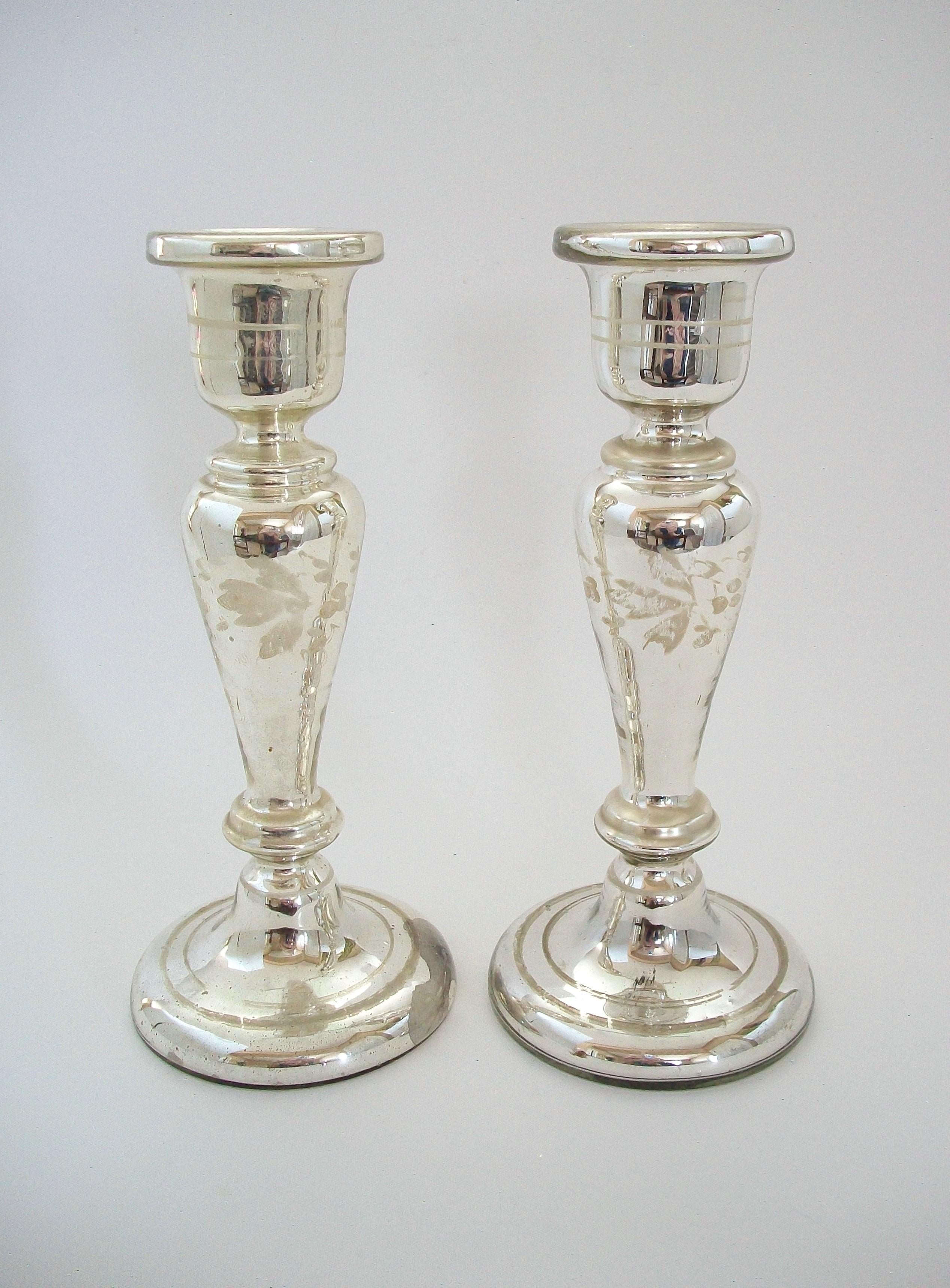 Large antique pair of white painted Mercury glass candlesticks - featuring hand painted bands of leaves and berries to each - double band lines to the sockets and bases - unsigned - France - circa 1880.

Excellent antique condition - paint loss -