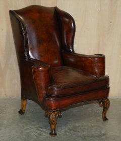 Antique Pair of William Morris Carved Legged Wingback Bordeaux Leather Armchairs