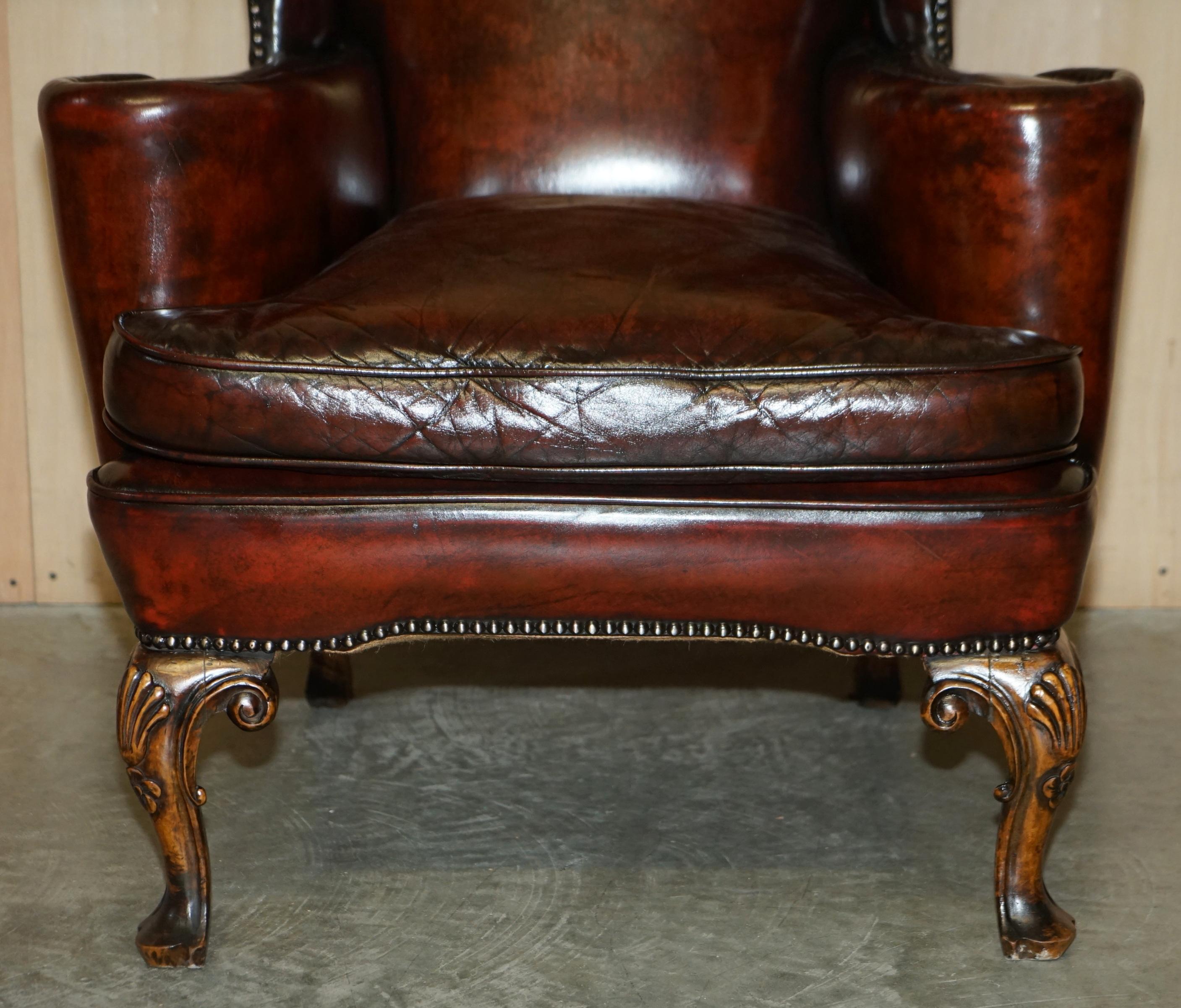 Hand-Crafted Antique Pair of William Morris Carved Legged Wingback Bordeaux Leather Armchairs