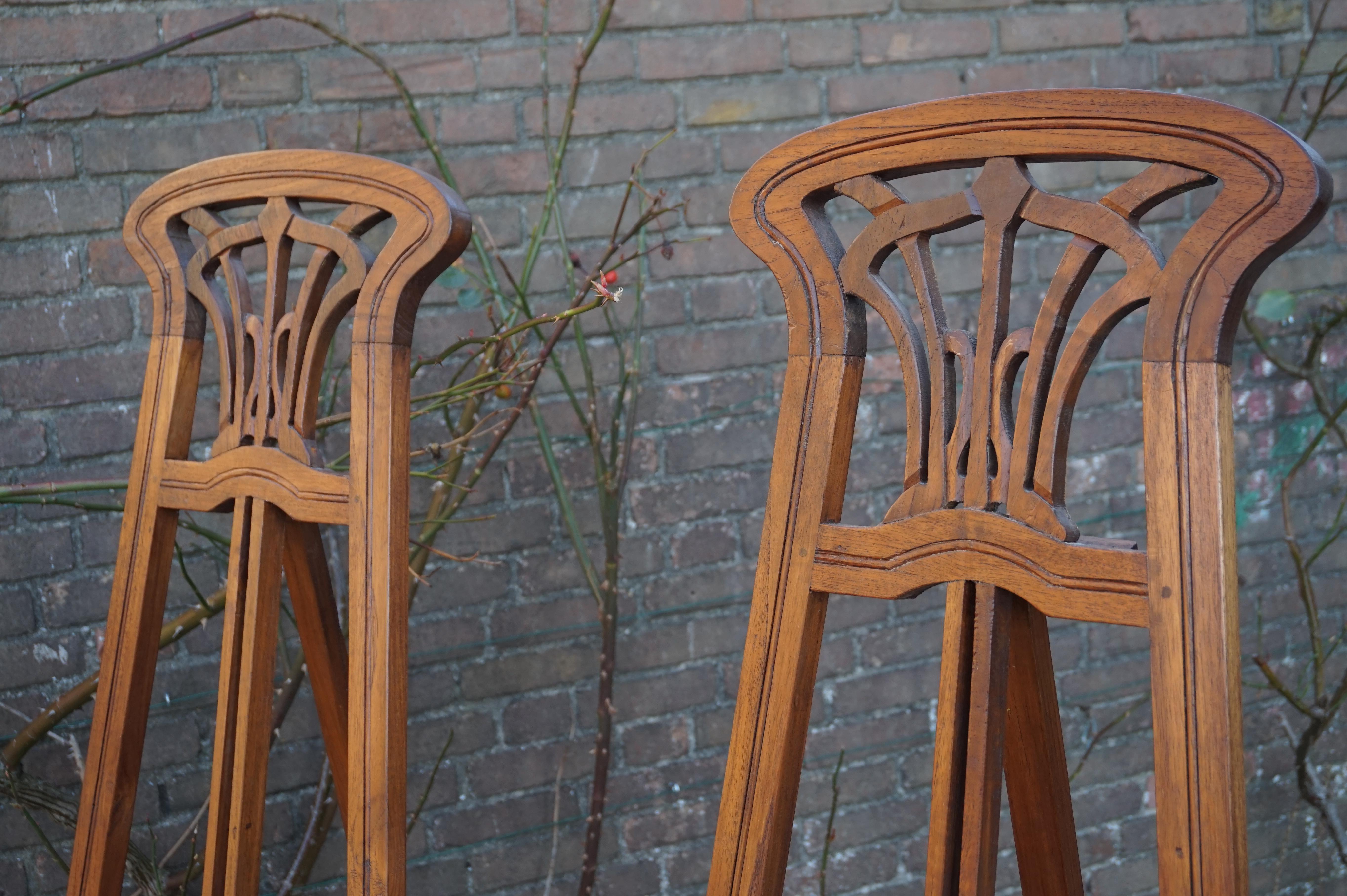 Early 20th century pair of teak wood painting stands. 

The family we acquired these easels from closed up their gallery about 15 years ago and these easels were gathering dust in the attick. Lucikily through a mutual acquaintance we found out about