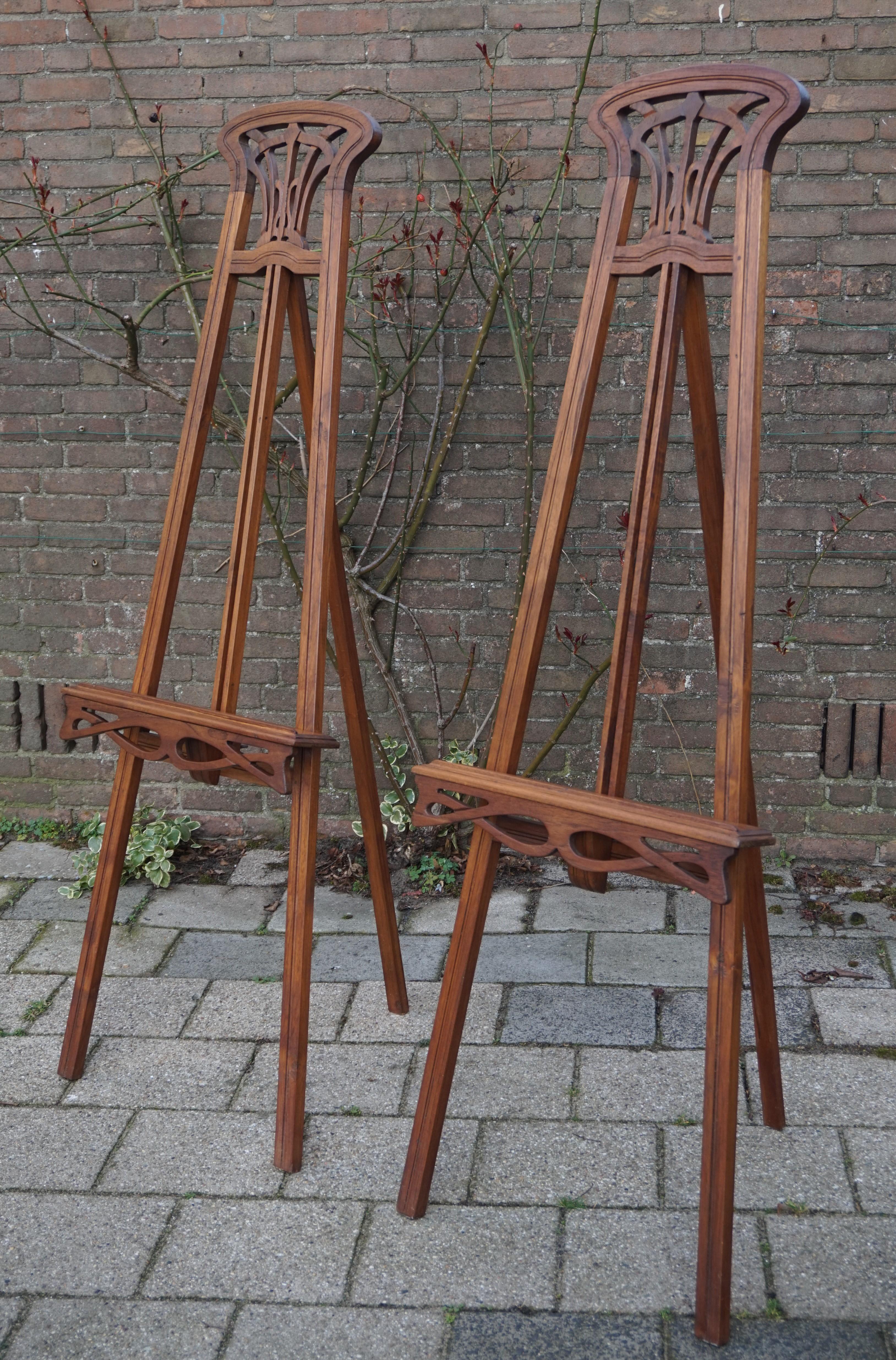 Early 20th century pair of teak wood painting stands. 

The family we acquired these easels from closed up their gallery about 15 years ago and these easels were gathering dust in the attick. Luckily through a mutual acquaintance we found out about
