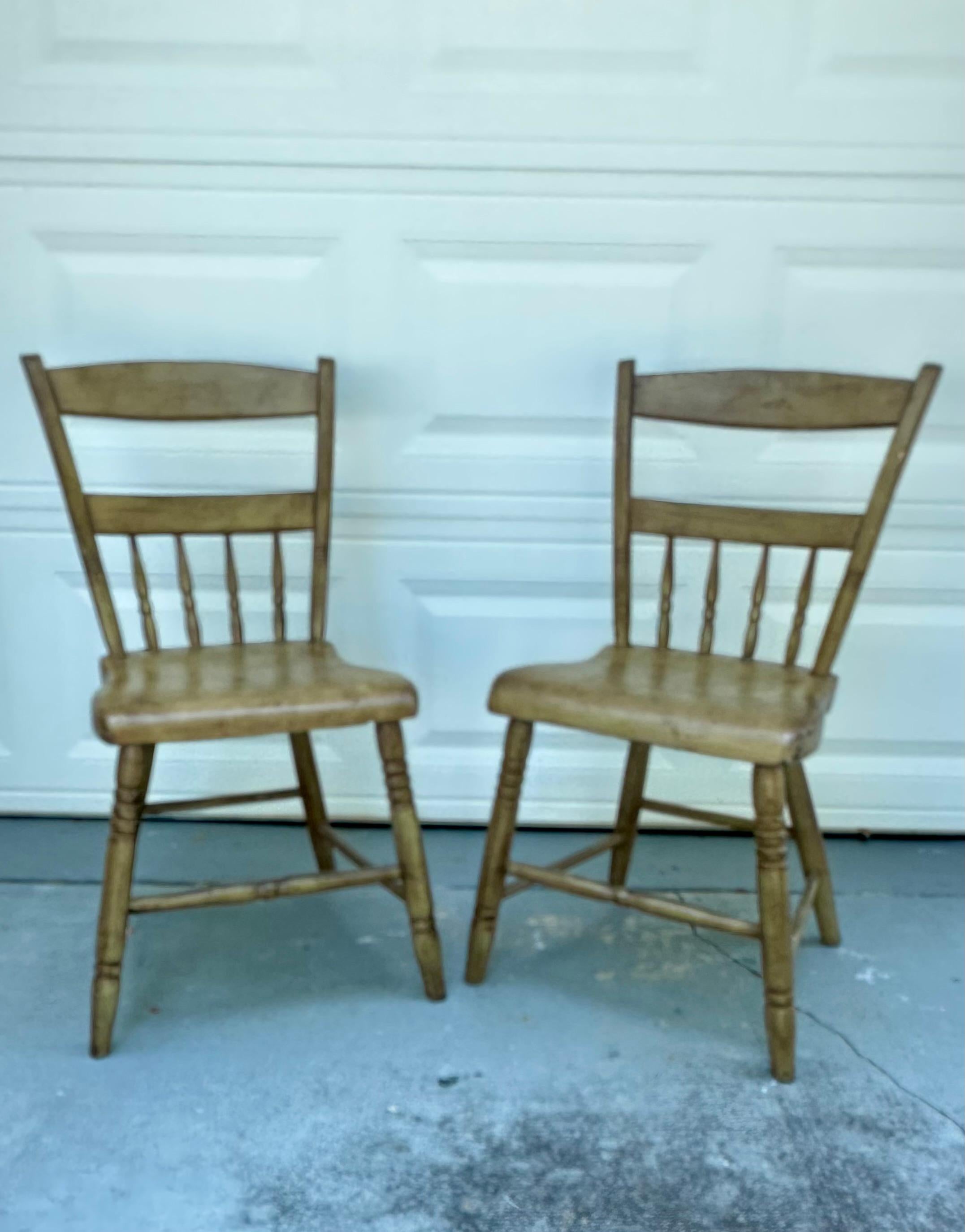 Antique Pair Pennsylvania Plank Seat Chairs 19th Century

Matching pair of antique primitive handmade farmhouse plank bottom seat spindle back chairs. These classic country chairs date from the first half of the 19th century. They are hand crafted