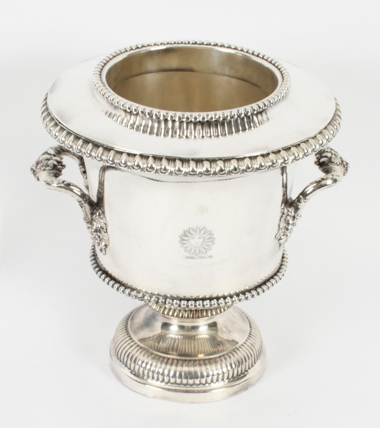 This is an exceptional pair of antique English Old Sheffield Plate silver on copper wine cooler bearing the Pearson family crest, circa 1820 in date.
 
The wine coolers stand on widespread circular pedestal bases with fluted decoration and the