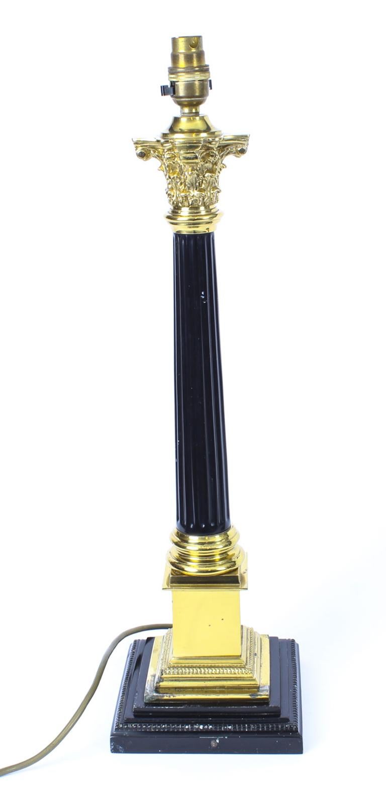 This is a stunning antique pair of Regency style ormolu and bronze Corinthian column table lamps, late 19th century in date.

They each feature a classic Corinthian Capital decorated with acanthus leaves, the shaft has invert fluting, on a stepped