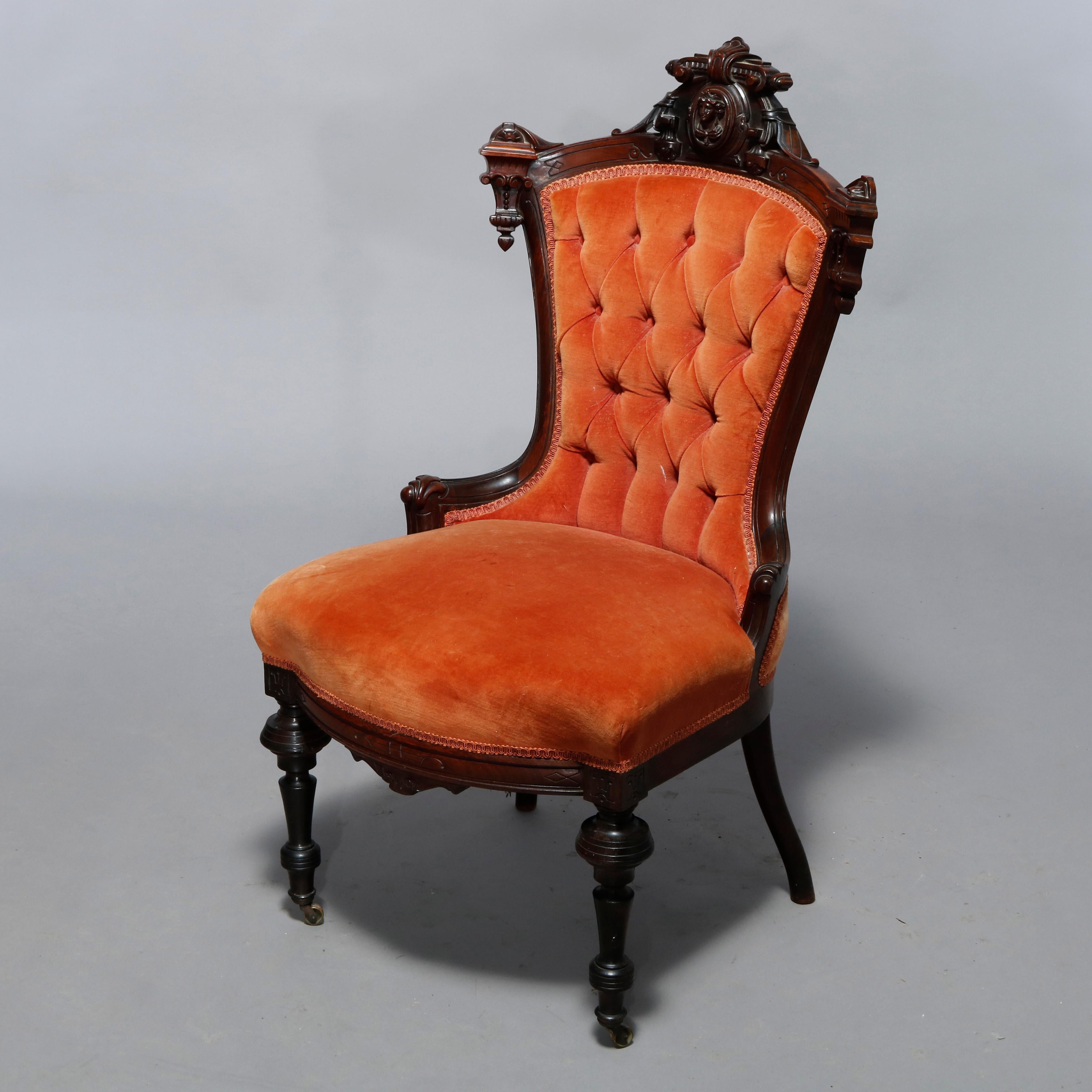 An antique pair Renaissance Revival figural boudoir chairs by Jelliff offer rosewood construction with carved rail having central mask with flanking drop finials, button back and upholstered seat raised on turned legs, 19th century

Measures: peach