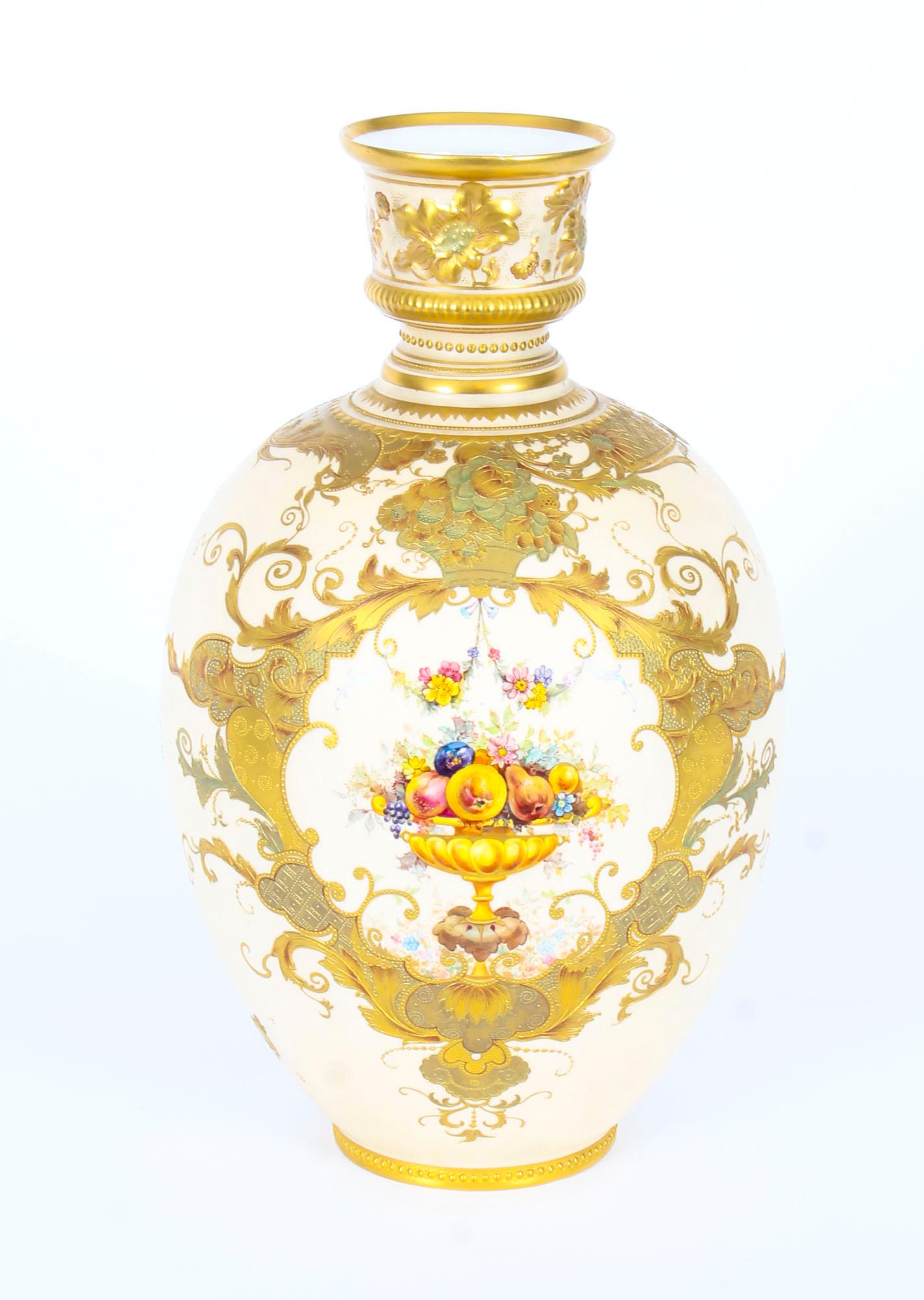 This is a truly exquisite and rare pair of late Victorian Royal Crown derby blushed porcelain cabinet vases, bearing the date code for 1891.

This stunning pair of vases have gilt edged flower head moulded necks above stunning painted sprays of