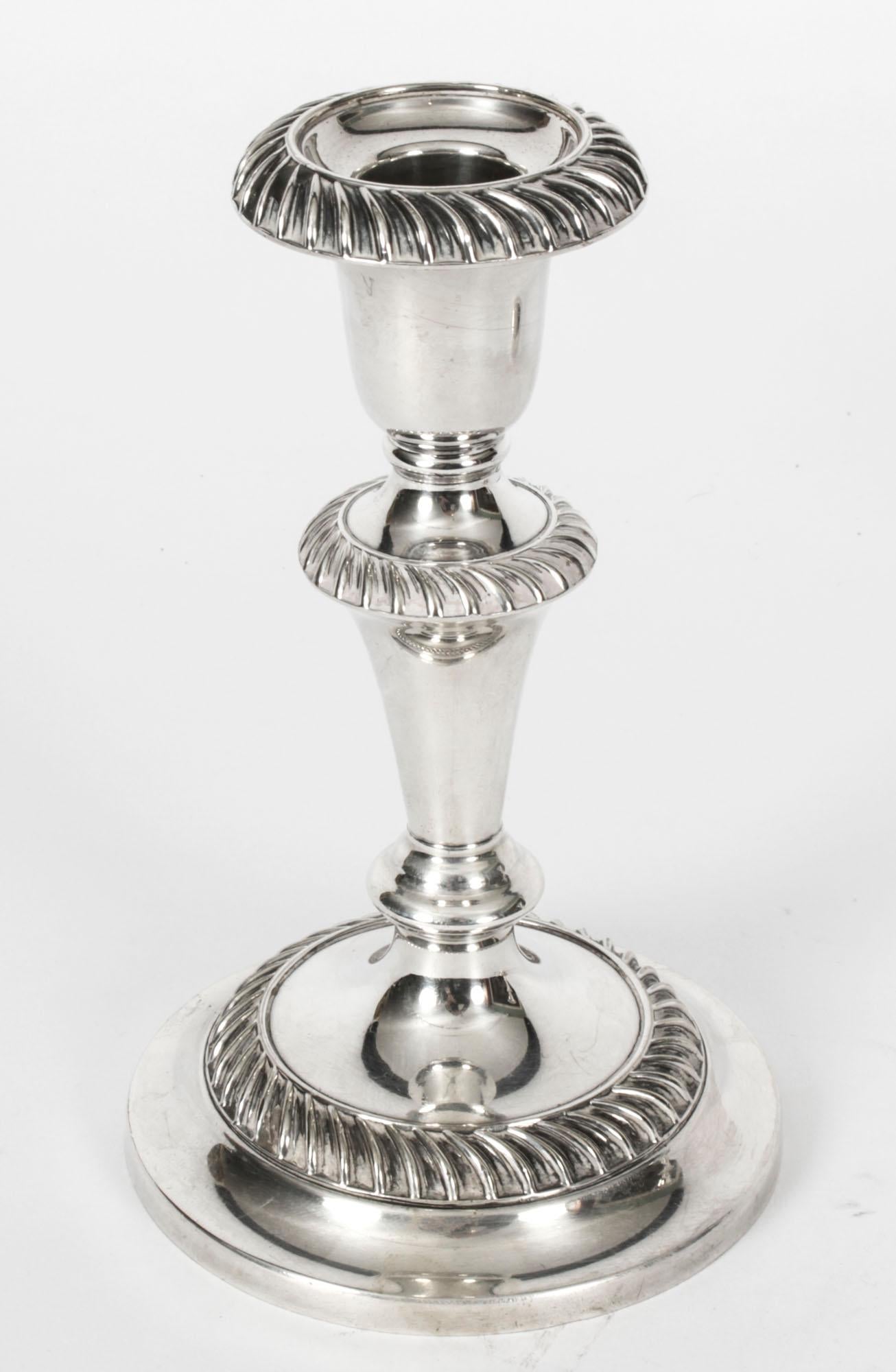 A fabulous pair of antique Edwardian silver plated candlesticks bearing the makers mark S.L into a shield, for Sydney Latimer, Circa 1910 in date.

Of fabulous quality, made of silver on copper, with wonderful embossed decoration.

There is no