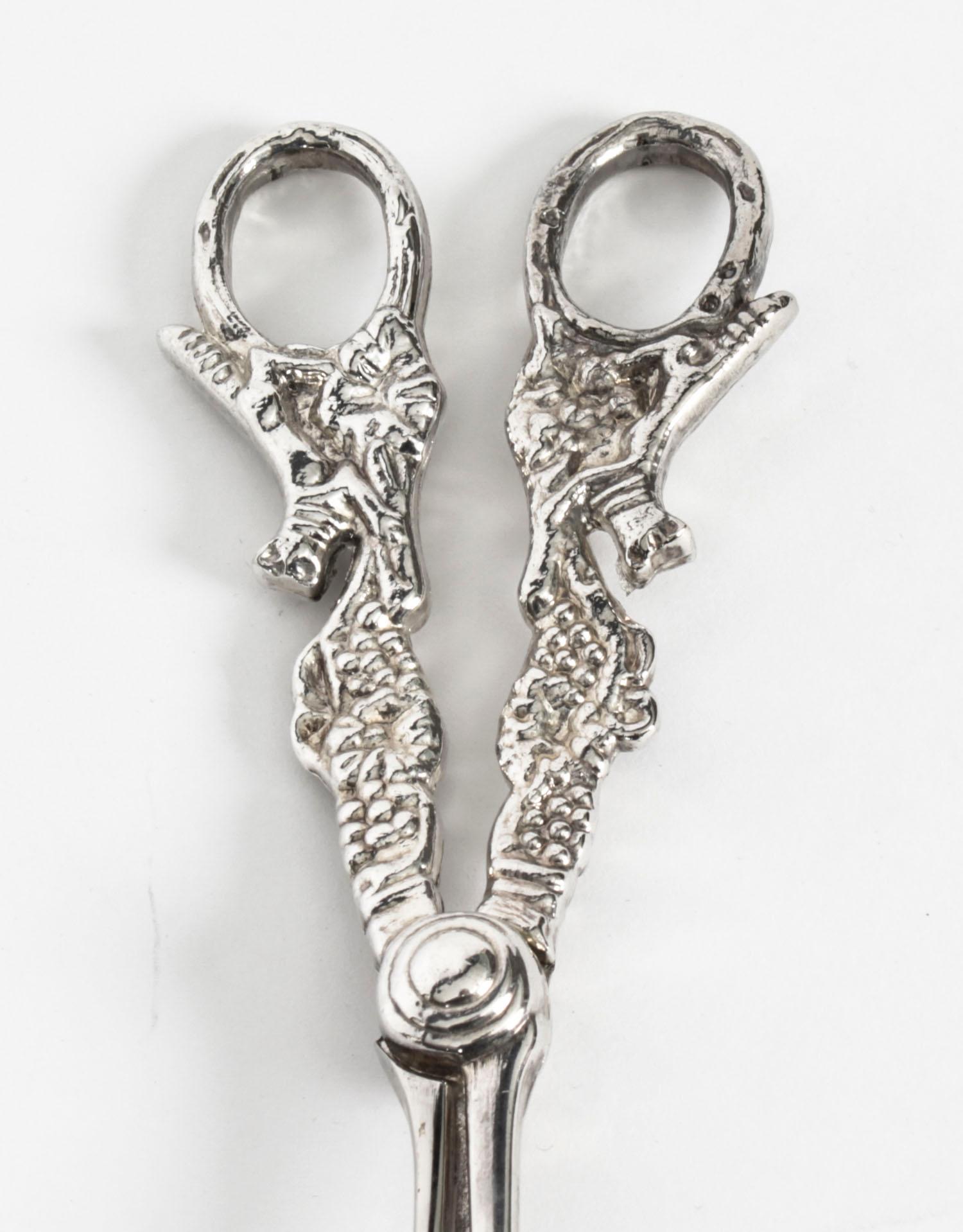 This is a very lovely pair of antique Victorian silver plated grape scissors, circa 1880 in date.

They feature grape vine decoration to the arms with foxes on the handles.

Add an elegant touch to your next dining experience.

Condition:
In